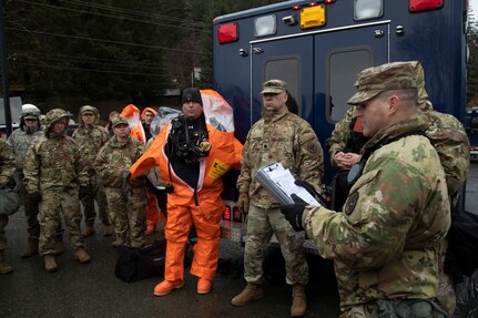 Alaska Army National Guard Staff Sgt. Jonathan Ramos, section team leader for the 103rd Civil Support Team, gives an exercise brief before down-range operations during Van Winkle 2022 in Juneau, Alaska, March 22. Van Winkle 2022 is a chemical, biological, radiological, nuclear and explosive response exercise designed to enhance interoperability between state, federal and local first responders with complex training scenarios. Exercise participants included CST units from the Alaska National Guard, Montana National Guard, Connecticut National Guard, Mississippi National Guard and North Carolina National Guard.