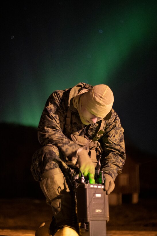 U.S. Marine Corps Lance Cpl. Tyson Franklin sets up communication equipment during Exercise Cold Response 2022, Sandstrand, Norway, March 21, 2022. Franklin is a transmissions system operator with 3rd Battalion, 6th Marine Regiment, 2d Marine Division, II Marine Expeditionary Force. Exercise Cold Response '22 is a biennial Norwegian national readiness and defense exercise that takes place across Norway, with participation from each of its military services, as well as from 26 additional NATO allied nations and regional partners. (U.S. Marine Corps photo by Cpl. Jacqueline C. Arre)