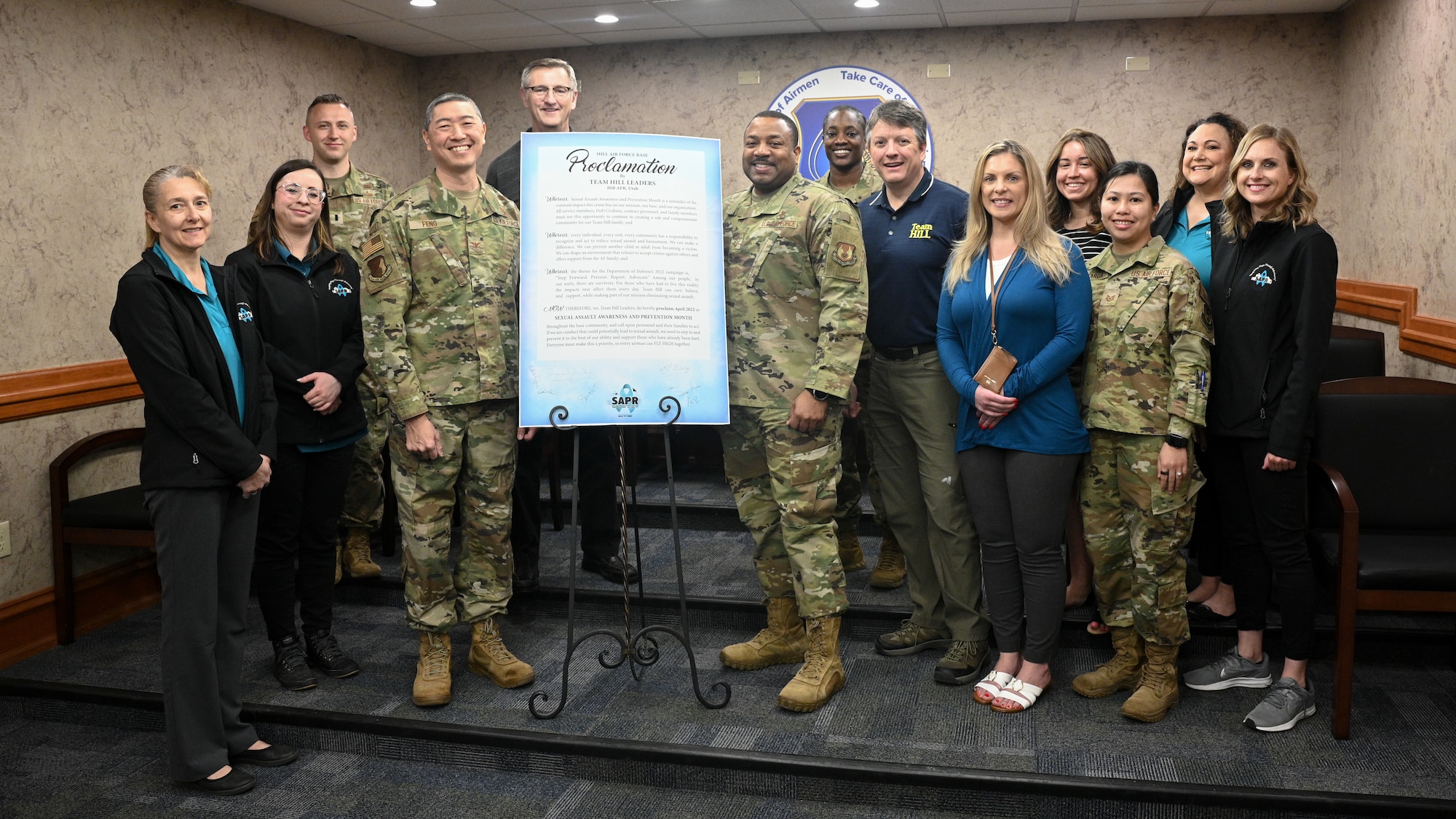 Base leadership and members of Hill's Sexual Assault Prevention and Response office stand for a photo at Hill Air Force Base, Utah.