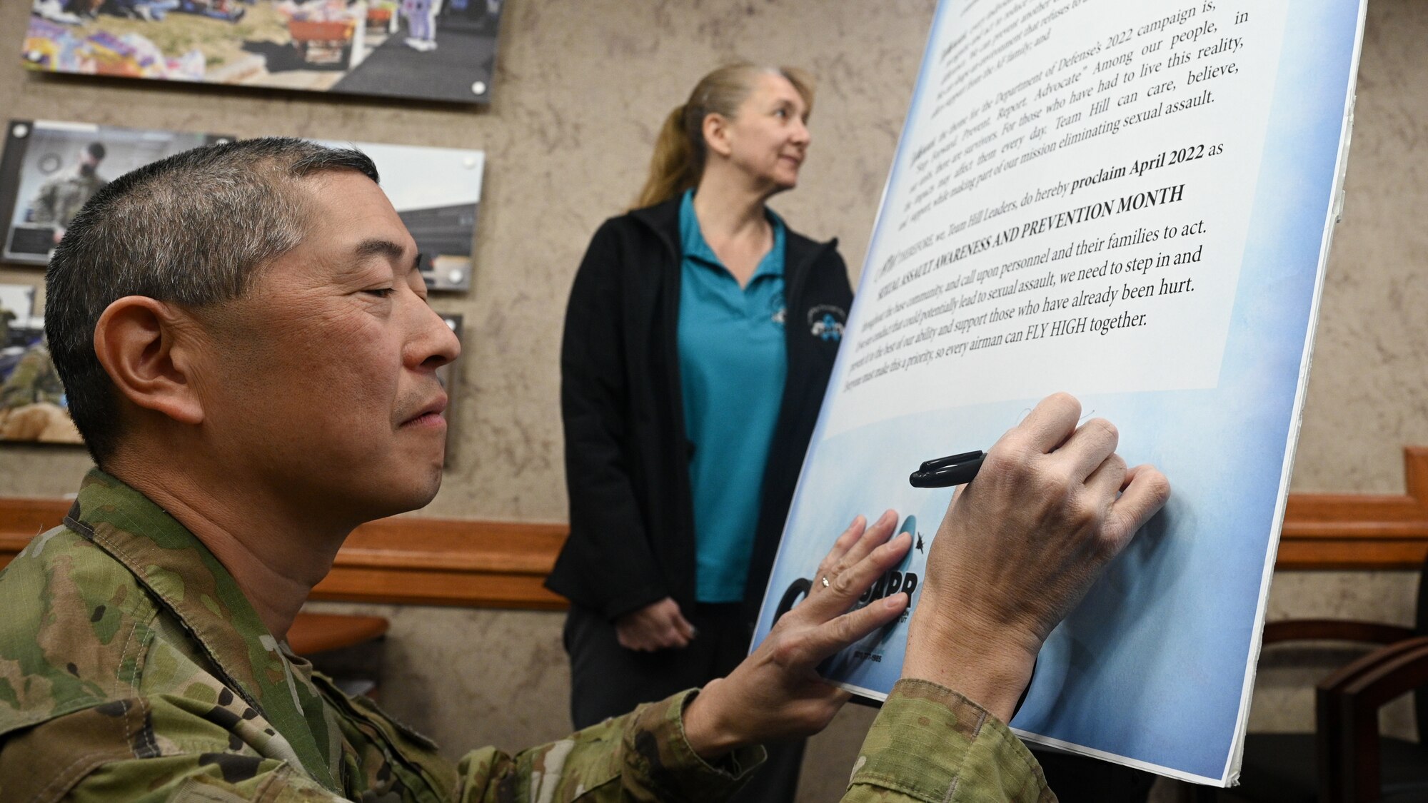 Col. Peter Feng, 75th Air Base Wing vice commander, signs the Sexual Assault Awareness and Prevention Month (SAAPM) proclamation at Hill Air Force Base, Utah.