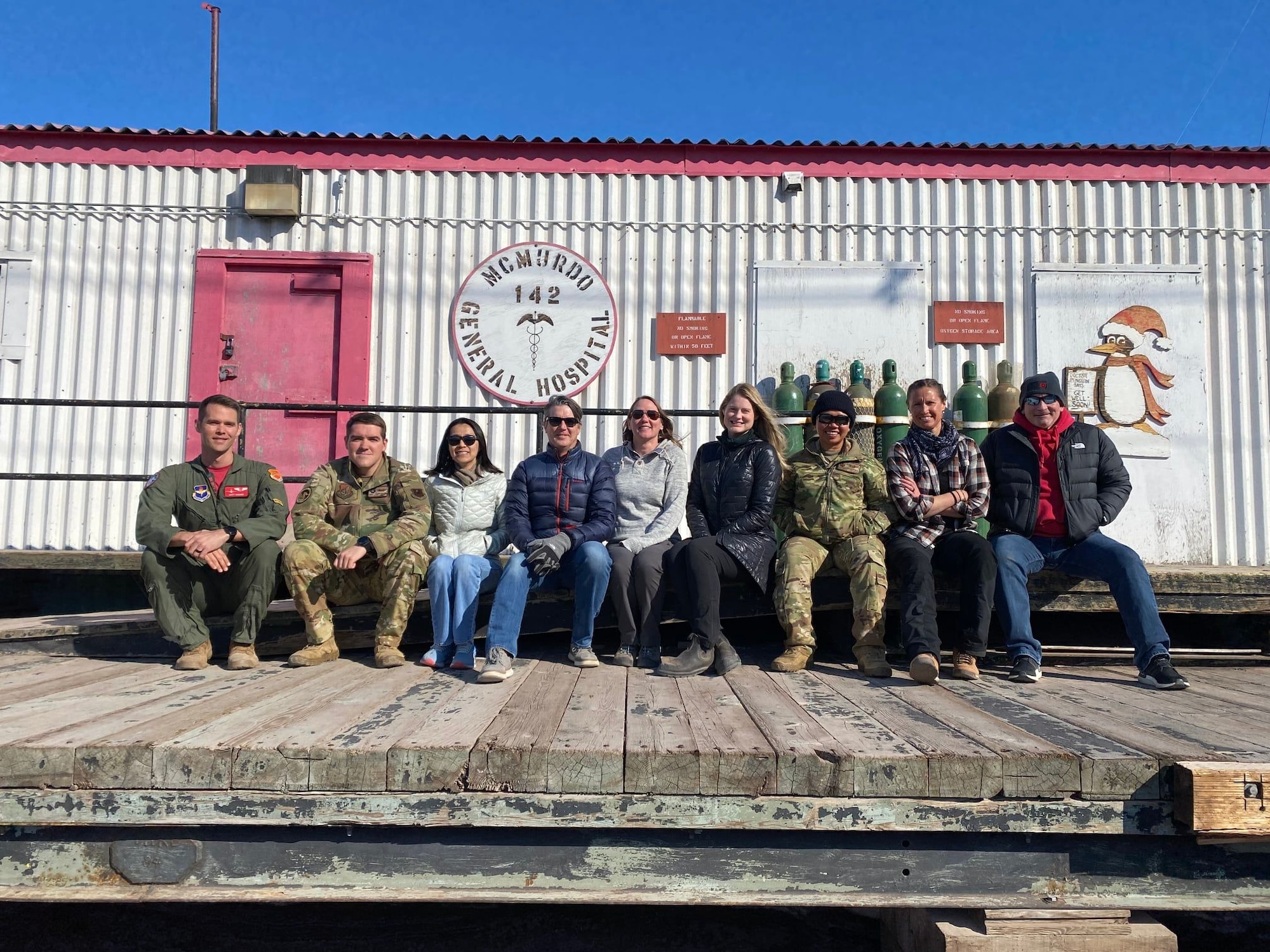 U.S. Air Force Maj. Matthew Wimmer, (far left) 56th Operations Group flight surgeon, poses for group photo with his medical team at McMurdo Station, Antarctica, in 2021.
