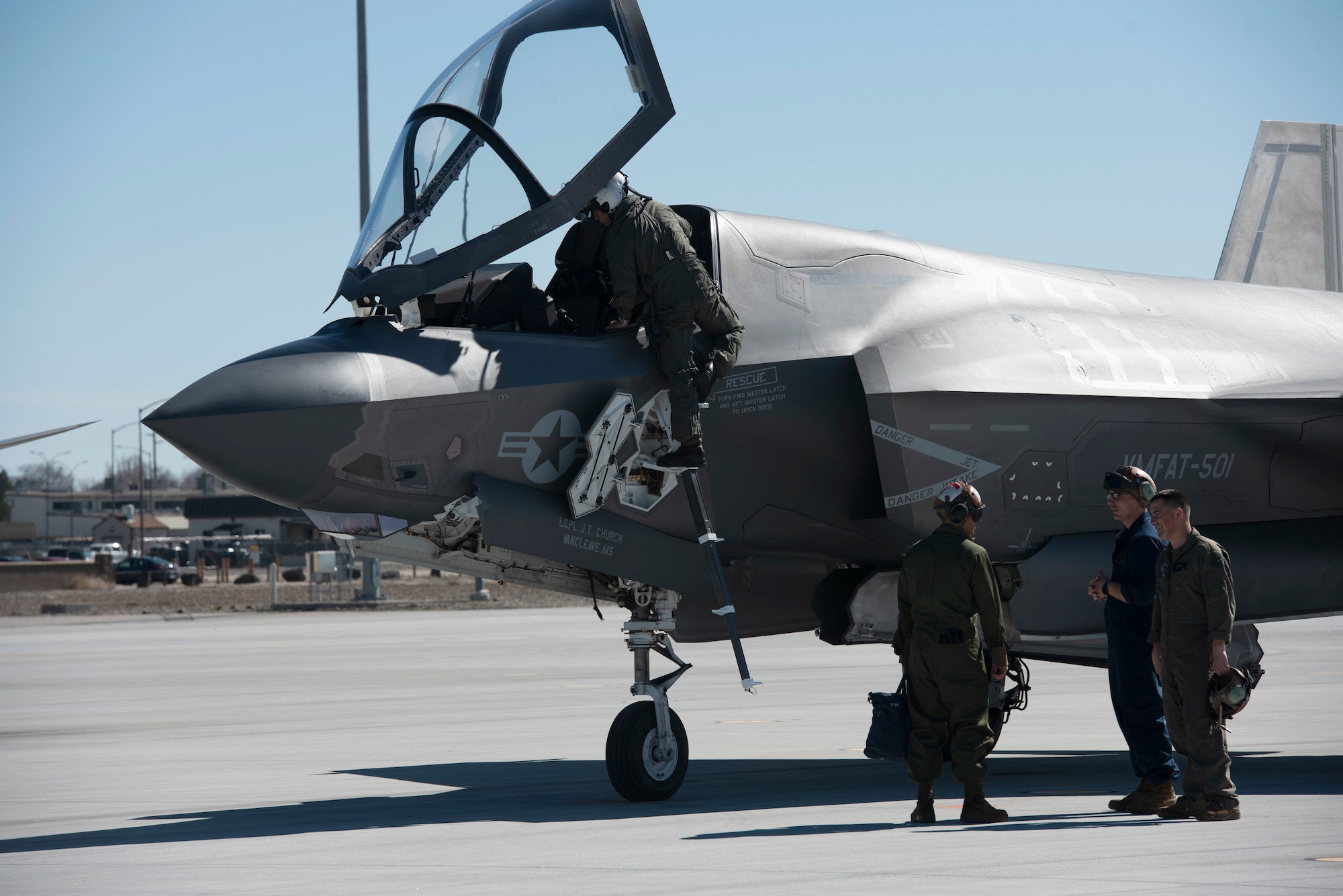 A Marine climbs off a F-35B Lightning II fighter jet.