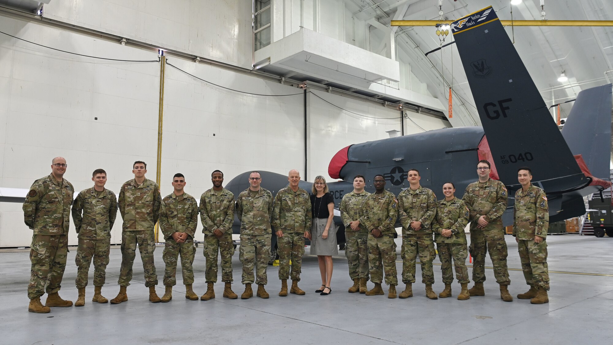 U.S. Space Force Gen. John W. “Jay” Raymond, Chief of Space Operations, takes a group photo with 12 Guardians who are assigned to Andersen Air Force Base, Guam, during a tour March 26, 2022. These Guardians transferred from the Air Force to the Space Force over the last 18 months and are awaiting future permanent change of station assignments to USSF units. (U.S. Air Force photo by Staff Sgt. Aubree Owens)