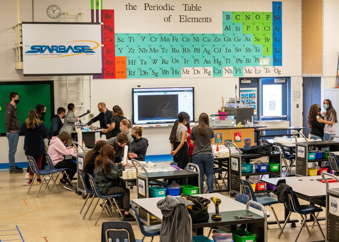 STARBASE Edwards Mighty in STEM Sisters (MiSS) work with girls from local students as they prepare to take part in the American Rocketry Challenge at Edwards Air Force Base, California, Feb. 15 (Air Force photo by Katherine Franco)