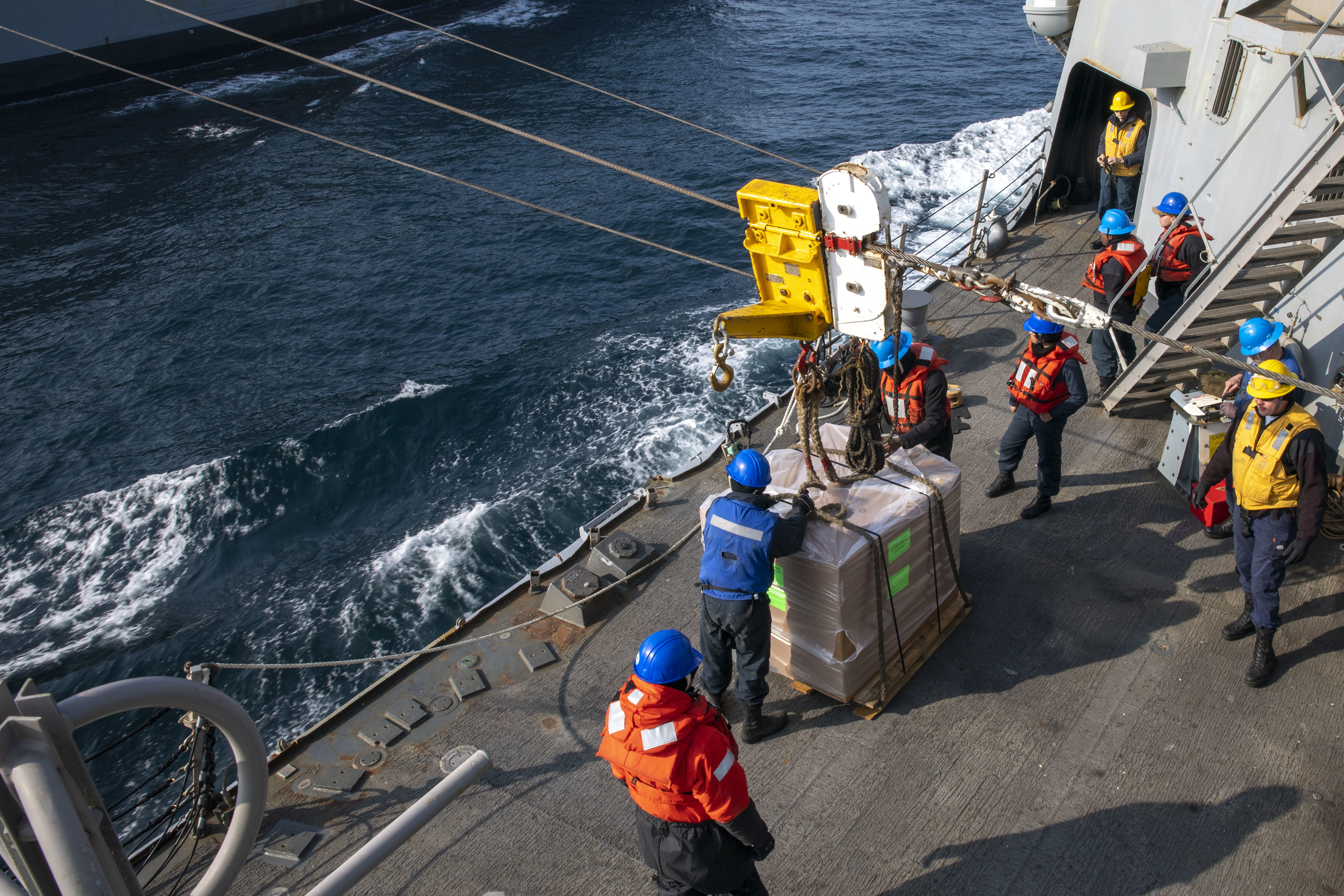 The Arleigh Burke-class guided-missile destroyer USS Forrest Sherman (DDG 98) conducts a replenishment-at-sea with USNS Patuxent (T-AO-201).