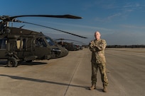 Chief Warrant Officer (5) David Hammon, of Sherman, Illinois, Command Chief Warrant Officer of the Illinois National Guard, poses for a photo prior his final flight as a Black Hawk pilot on March 15 at the Decatur, Illinois Aviation Facility. Hammon retires from the Illinois Army National Guard April 30 after a 42 year career.