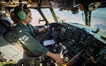 Cmdr. Jessica Caldwell, commanding officer of the "Providers" of Fleet Logistics Support Squadron (VRC) 30, pilots a C-2A Greyhound, March 23.