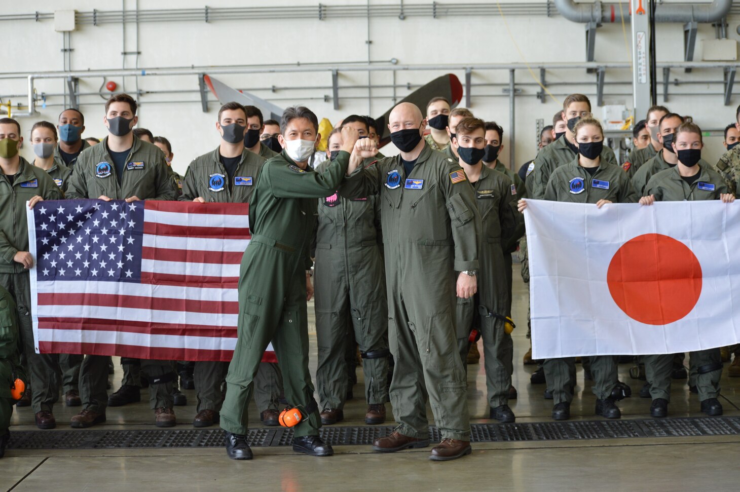 KADENA AIR BASE, Japan (March 28, 2022) – Capt. Hiroshi Miyaji, commanding officer of Japan Maritime Self-Defense Force Air Reconnaissance Squadron EIGHT ONE (VQ-81), poses for a photo with Cmdr. David Van Kampen, commanding officer of Fleet Air Reconnaissance Squadron ONE (VQ-1) during Raijin 22-1, an annual unit exchange. Based out of Whidbey Island, Washington, the VQ-1 “World Watchers” are currently operating from Kadena Air Base in Okinawa, Japan. The squadron conducts naval operations as part of a rotational deployment to the U.S. 7th Fleet area of operations. (U.S. Navy photo by Mass Communication Specialist First Class Glenn Slaughter)