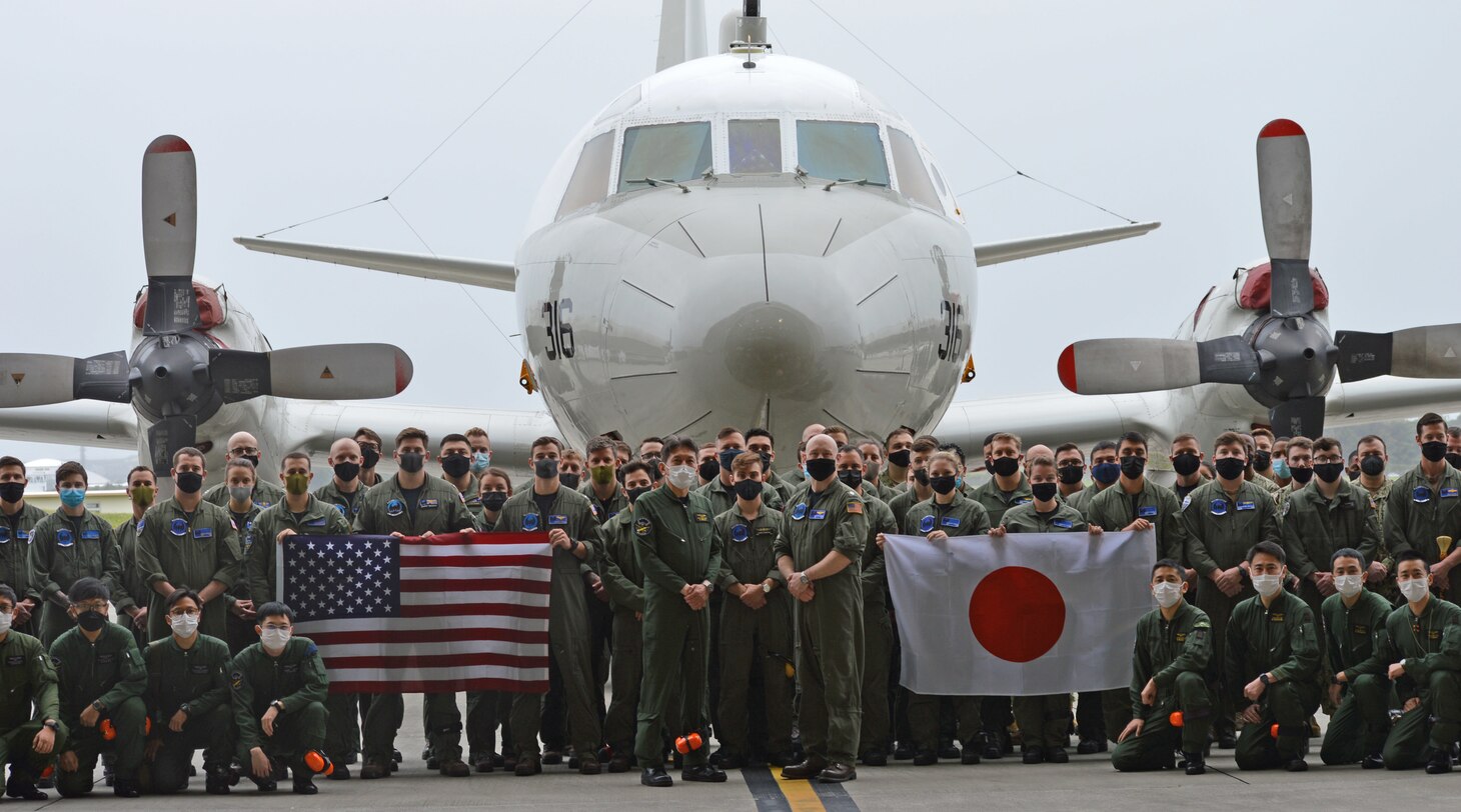 KADENA AIR BASE, Japan (March 28, 2022) – Members of Japan Maritime Self-Defense Force Air Reconnaissance Squadron EIGHT ONE (VQ-81) and Fleet Air Reconnaissance Squadron ONE (VQ-1) pose for a photo during Raijin 22-1, an annual unit exchange. Based out of Whidbey Island, Washington, the VQ-1 “World Watchers” are currently operating from Kadena Air Base in Okinawa, Japan. The squadron conducts naval operations as part of a rotational deployment to the U.S. 7th Fleet area of operations. (U.S. Navy photo by Mass Communication Specialist First Class Glenn Slaughter)