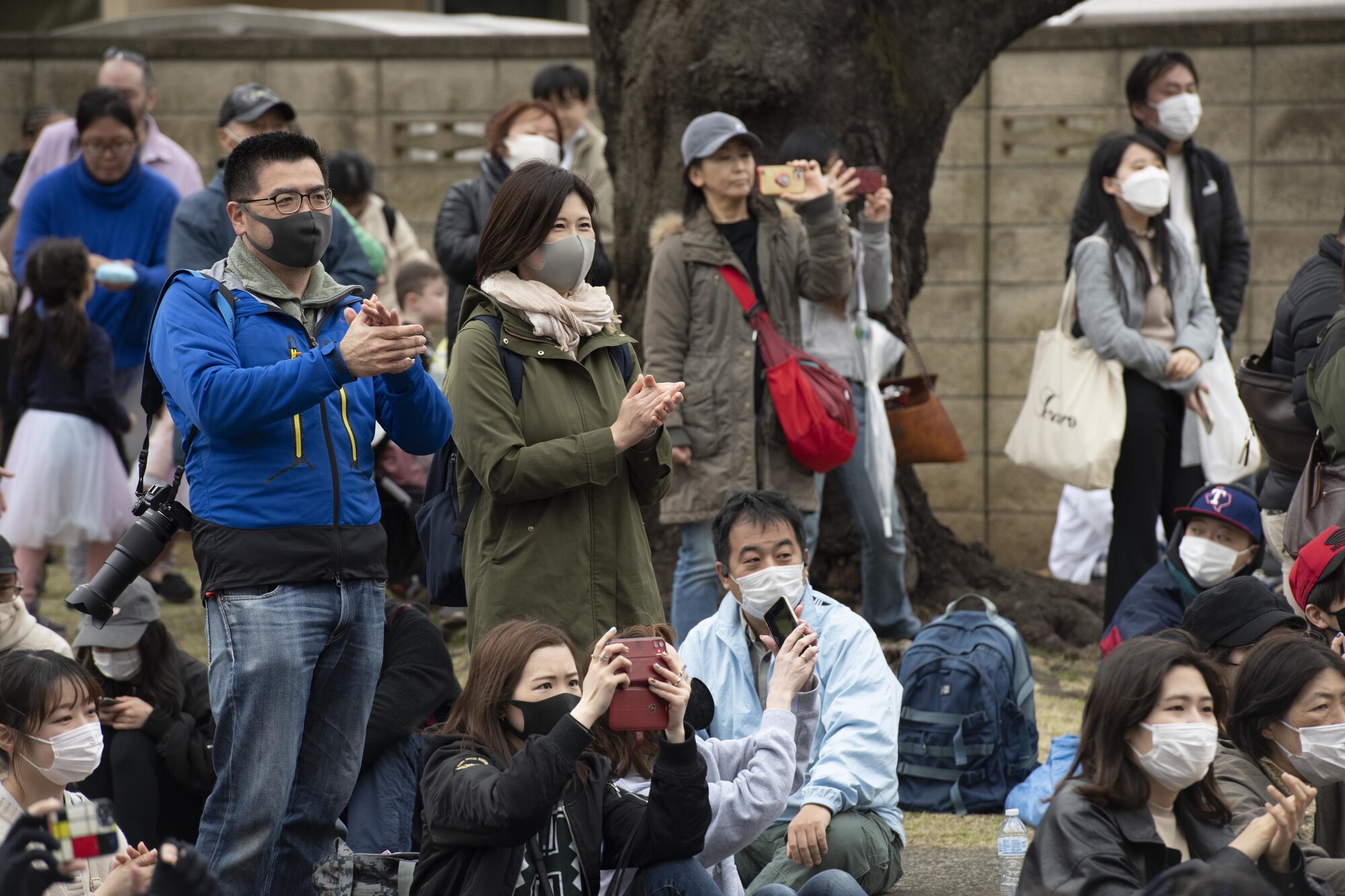Members of Yokota Air Base and Japanese community cheer for the Pacific Air Forces Band as they perform during the Sakura Spring Festival March 26, 2022, at Yokota Air Base, Japan.