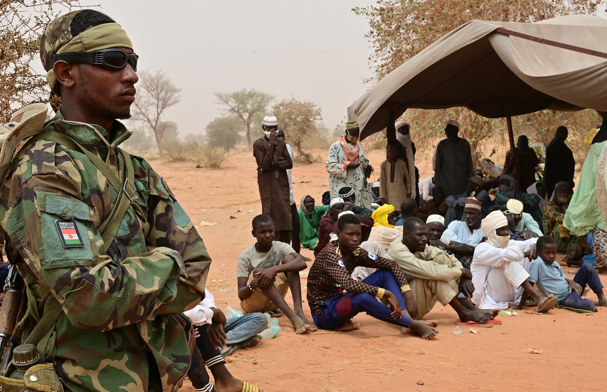 A Niger Armed Forces soldier provides security during a medical civic action program (MEDCAP) in Ouallam, Niger, March 16, 2022. The Niger-U.S. joint MEDCAP provided medical treatment to approximately 550 patients, ranging from babies to the elderly. (U.S. Air Force photo by Tech. Sgt. Stephanie Longoria)