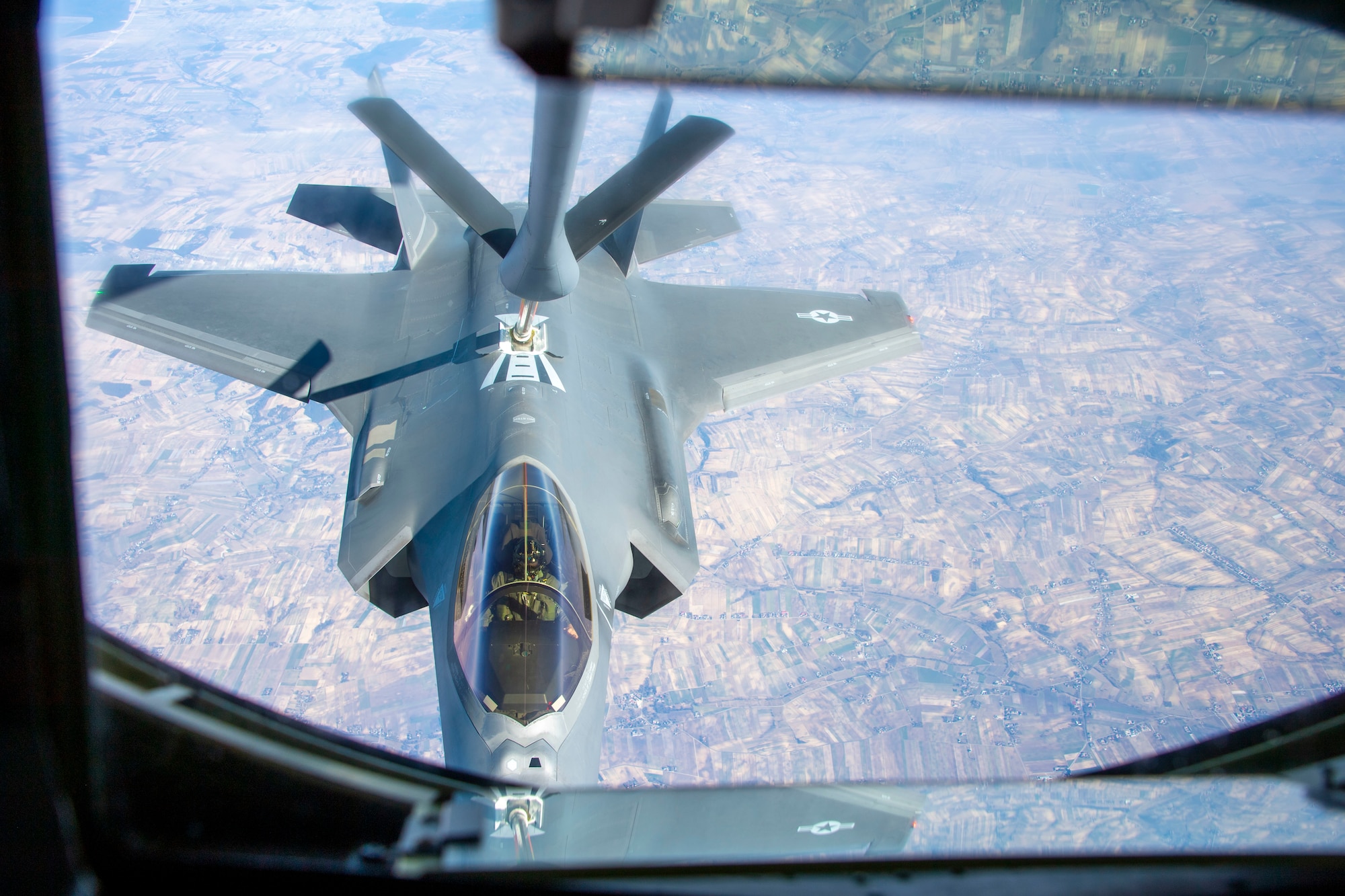 An F-35A Lightning II assigned to Hill Air Force Base, Utah, latches on to a boom to receive fuel from a KC-135 Stratotanker assigned to Fairchild Air Force Base, Washington, March 22, 2022. Airmen and F-35s were tasked to support NATO’s collective defense within the European theater. (U.S. Air Force photo by Airman 1st Class Jessica Sanchez-Chen)