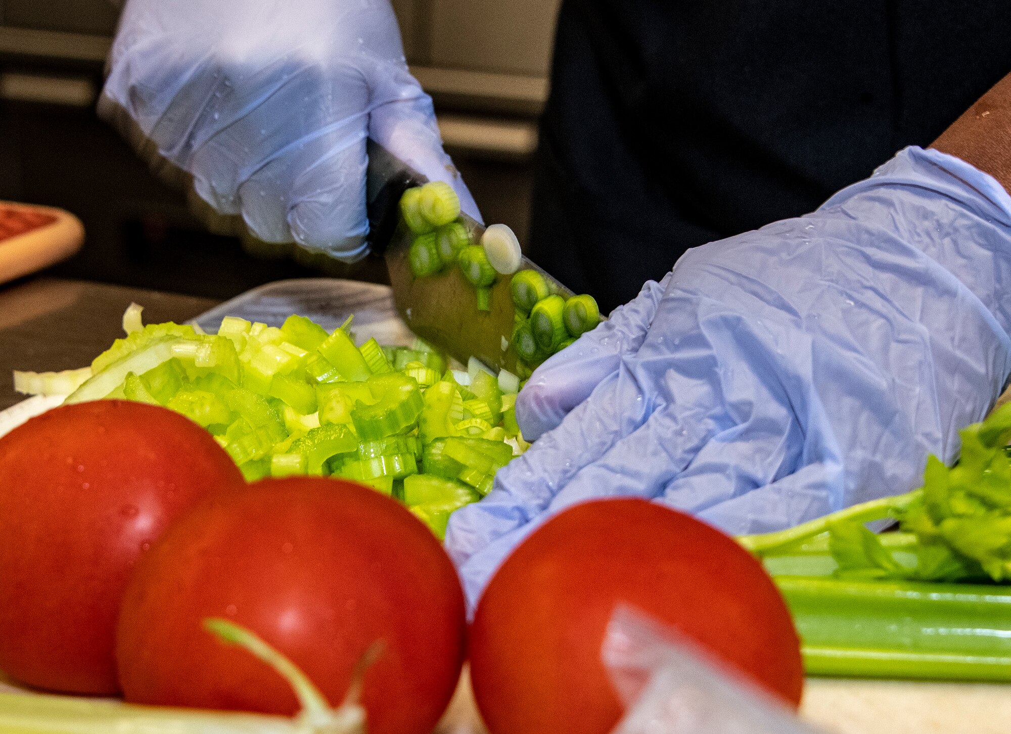 an airman cooks food