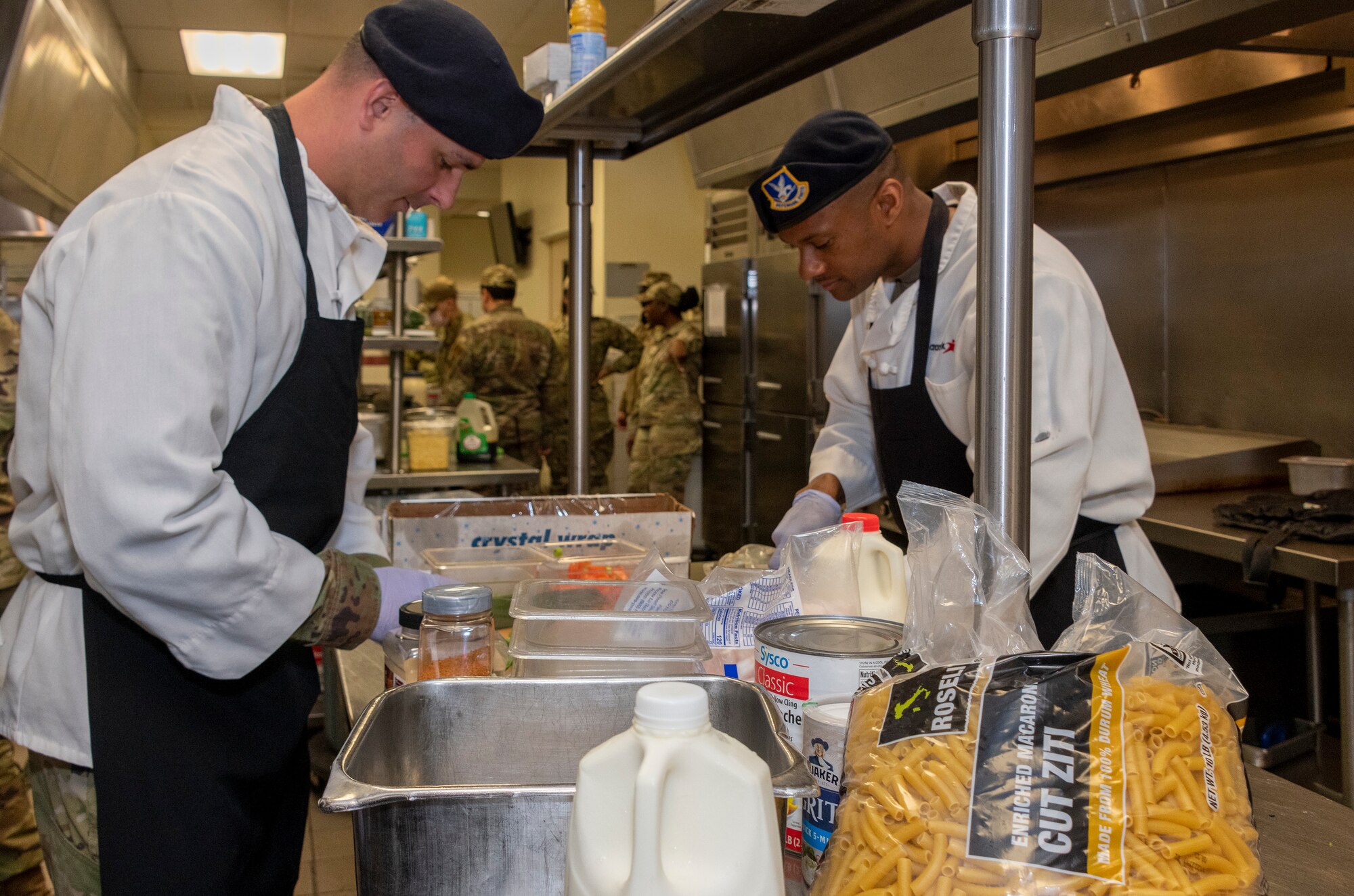 an airman cooks food