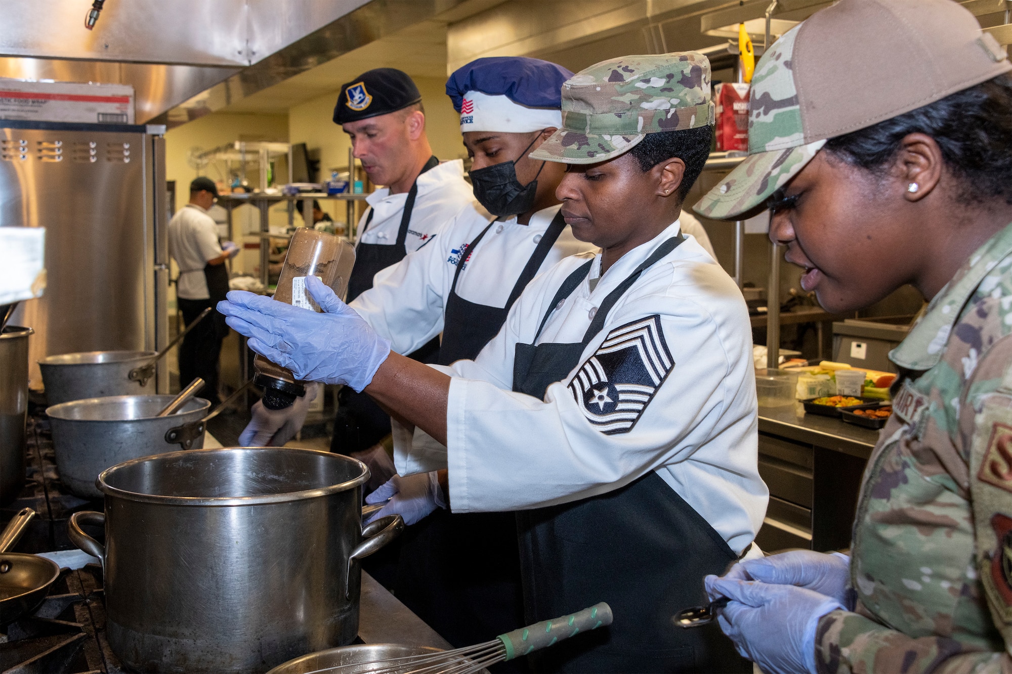 Airmen cook food