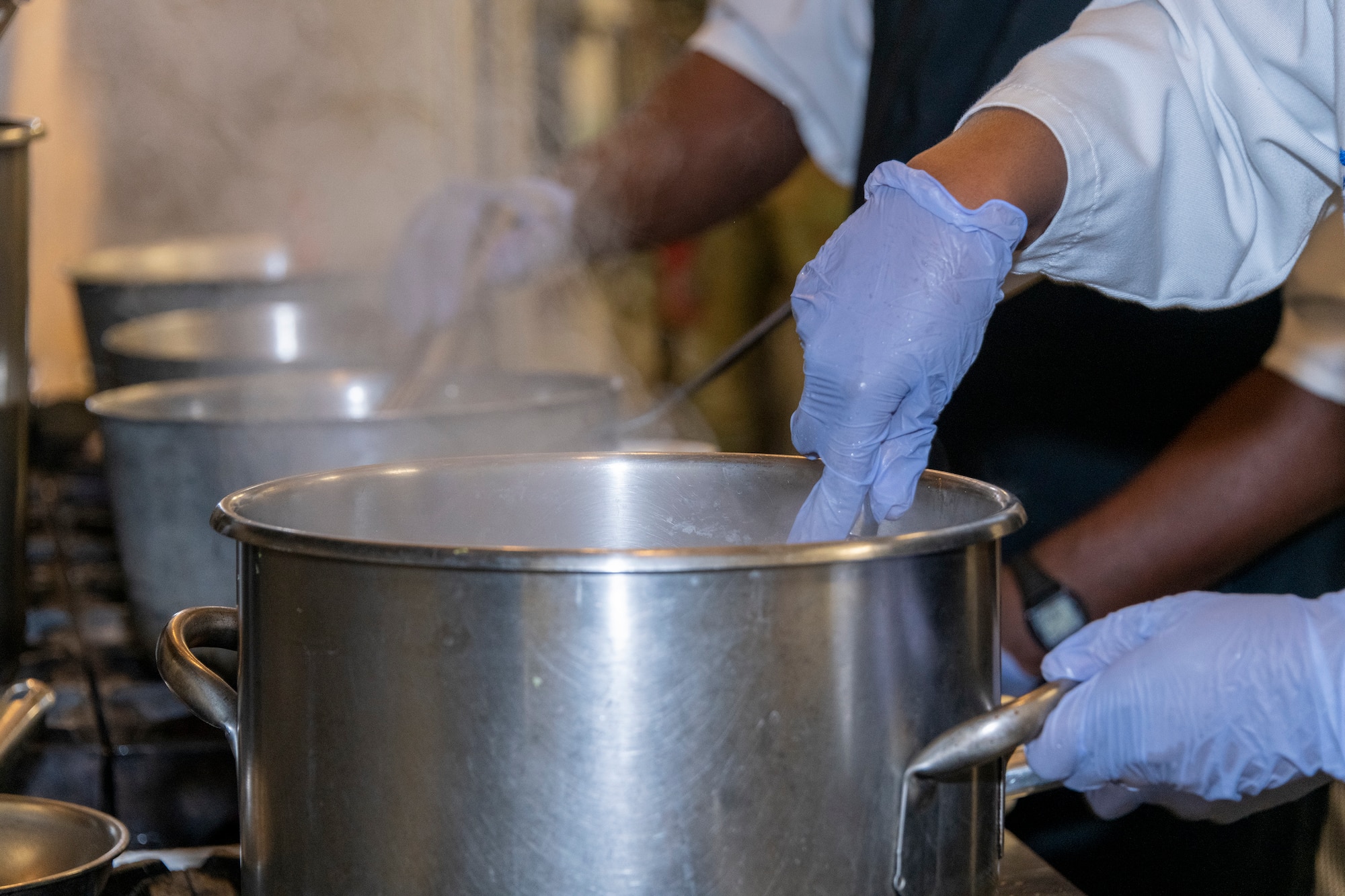 an airman cooks food