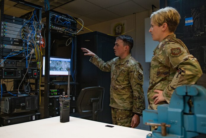 Base leader speaks with Airman