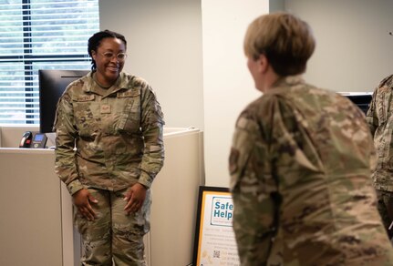 Base leader speaks with Airman
