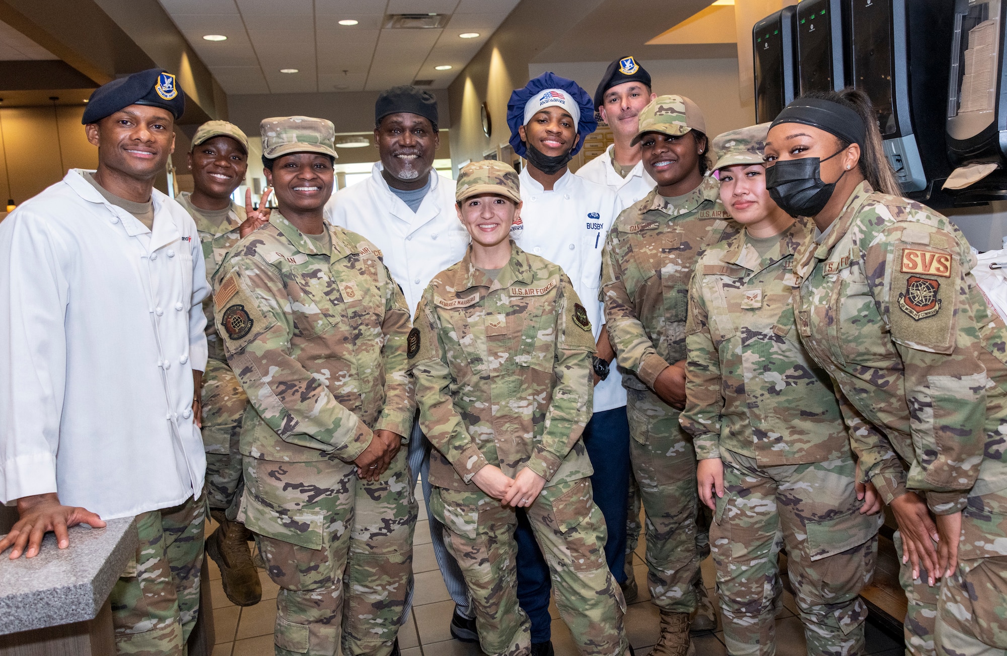 U.S. Airmen assigned to the 60th Mission Support Group, participate in a Mardi Gras themed chopped competition at Travis Air Force Base, California, March 23, 2022. The 60th Mission Support Group Monarch Dining Facility hosted a cooking competition showcasing skill, speed and ingenuity. Teams of four competed to transform mystery ingredients into the main course and dessert dishes to present to a panel of judges. (U.S. Air Force photo by Heide Couch)