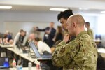 U.S. Air Force Tech. Sgt. Ezekiel Wieland, 272nd Cyber Operations Squadron, 110th Wing, Michigan Air National Guard, participates in a cyber warfare training event, Camp Grayling Joint Maneuver Training Center, Michigan, March 8, 2022.