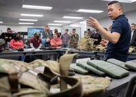 Neal Nguyen, lead systems engineer for Product Manager Soldier Protective Equipment at Program Executive Office (PEO) Soldier, discusses the modular scalable vest and its new plates to an audience during a gear comparison event on Fort Belvoir, March 8. The event provided a familiarization of selected items from Project Manager Soldier Survivability and the U.S. Army Special Operations Command’s respective portfolios for a side-by-side comparison, in order to gain knowledge and identify opportunities for collaboration in the future.