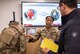 Capt. Kim Pierre-Zamora, assistant product manager for Product Manager Soldier Protective Equipment at Program Executive Office (PEO) Soldier, describes the functionality of the modular scalable vest to Sgt. 1st Class Dustin Resendez, Regiment S4 Operations Non-Commissioned Officer in Charge for U.S. Army Special Operations Command (USASOC), during a gear comparison event on Fort Belvoir, March 8. The event provided a familiarization of selected items from Project Manager Soldier Survivability and USASOC’s respective portfolios for a side-by-side comparison, in order to gain knowledge and identify opportunities for collaboration in the future.