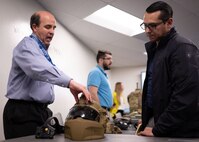 Alex DeGroot, lead systems engineer for helmet protection at Program Executive Office (PEO) Soldier, demonstrates the Next Generation Integrated Helmet Protections System to Sgt. 1st Class Dustin Resendez, Regiment S4 Operations Non-Commissioned Officer in Charge for U.S. Army Special Operations Command (USASOC), during a gear comparison event on Fort Belvoir, March 8. The event provided a familiarization of selected items from Project Manager Soldier Survivability and USASOC’s respective portfolios for a side-by-side comparison, in order to gain knowledge and identify opportunities for collaboration in the future.