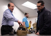 Alex DeGroot, lead systems engineer for helmet protection at Program Executive Office (PEO) Soldier, demonstrates the Next Generation Integrated Helmet Protections System to Sgt. 1st Class Dustin Resendez, Regiment S4 Operations Non-Commissioned Officer in Charge for U.S. Army Special Operations Command (USASOC), during a gear comparison event on Fort Belvoir, March 8. The event provided a familiarization of selected items from Project Manager Soldier Survivability and USASOC’s respective portfolios for a side-by-side comparison, in order to gain knowledge and identify opportunities for collaboration in the future.