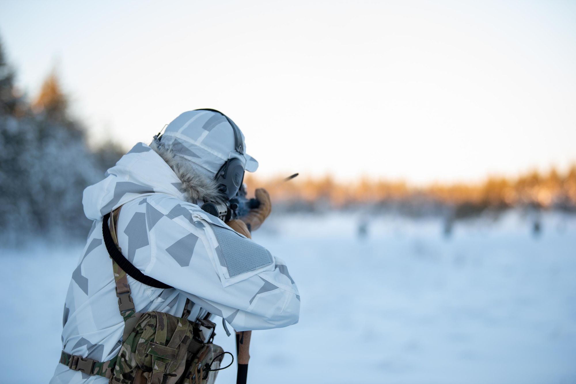 An Airman with the Kentucky Air National Guard’s 123rd Special Tactics Squadron fires a M4 rifle at a range in Grubbnäsudden, Sweden, Jan. 13, 2022. Fifteen members from the 123rd STS — including combat controllers; pararescuemen; special reconnaissance personnel; search, evasion, resistance and escape troops; and support Airmen — came here to build upon their relationship with European partners during an arctic warfare training course. (U.S. Air National Guard photo by Phil Speck)
