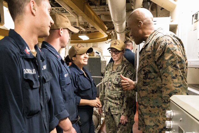 U.S. Marine Corps Lt. Gen. Michael E. Langley (right), the commander of Fleet Marine Force, Atlantic, Marine Forces Command, Marine Forces Northern Command, and Cmdr. Elizabeth A Nelson (center), commanding officer of the Whidbey Island-class dock landing ship USS Gunston Hall (LSD 44), thanks sailors for their hard work in preparing the ship for deployment on March 25, 2022. The USS Gunston Hall is one of the three Kearsarge Amphibious Ready Group dock landing ships scheduled to join 22nd Marine Expeditionary Unit who deployed earlier this month. (U.S. Marine Corps photo by Mr. Casey Price)