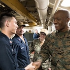U.S. Marine Corps Lt. Gen. Michael E. Langley (right), the commander of Fleet Marine Force, Atlantic, Marine Forces Command, Marine Forces Northern Command, and Cmdr. Elizabeth A Nelson (center), commanding officer of the Whidbey Island-class dock landing ship USS Gunston Hall (LSD 44), thanks sailors for their hard work in preparing the ship for deployment on March 25, 2022. The USS Gunston Hall is one of the three Kearsarge Amphibious Ready Group dock landing ships scheduled to join 22nd Marine Expeditionary Unit who deployed earlier this month. (U.S. Marine Corps photo by Mr. Casey Price)