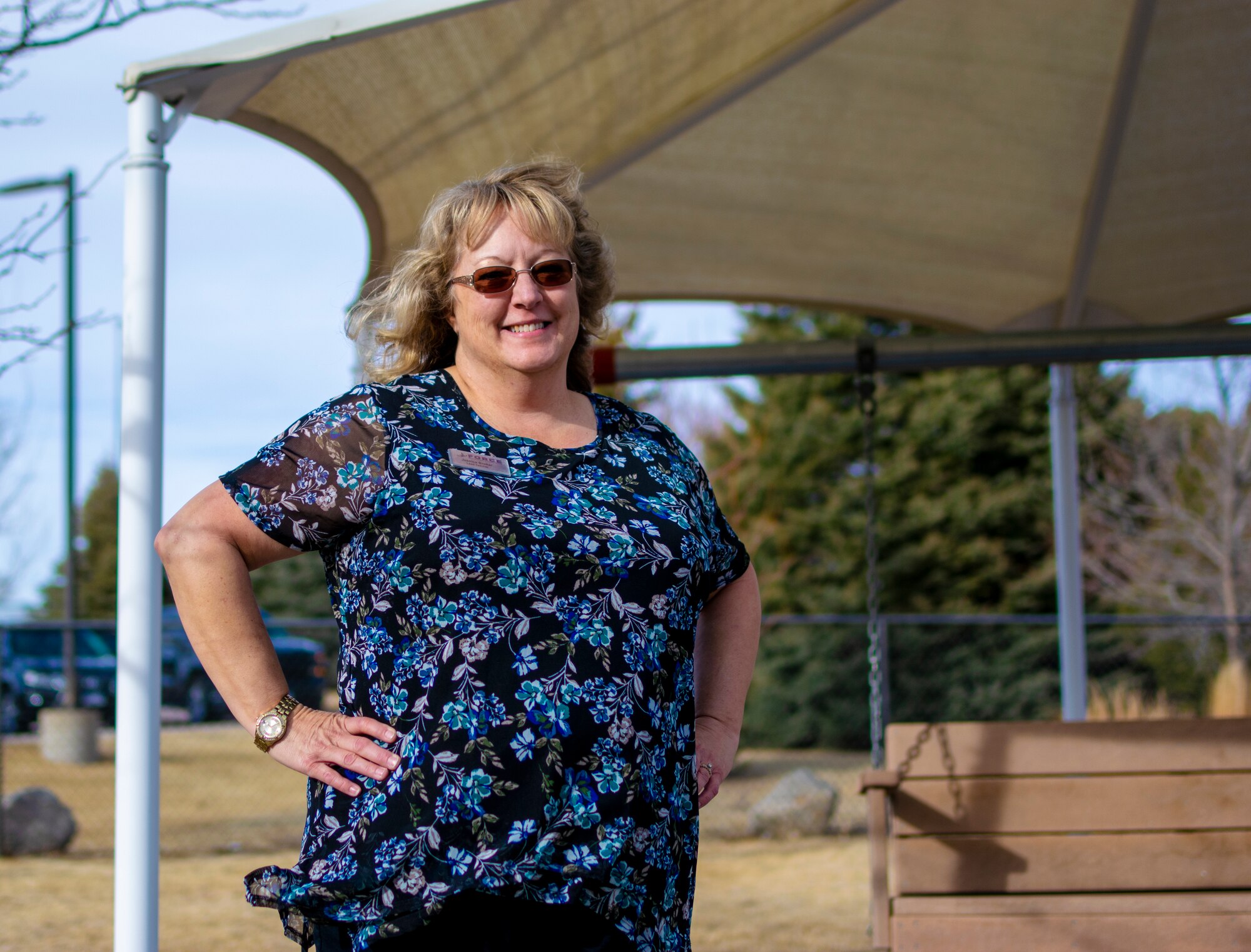 PETERSON SPACE FORCE BASE, Colo. — Jessica Brokar, 21st Force Support Squadron lead educational technician, stands outside of the main Childhood Development Center on Peterson Space Force Base, Colorado, March 3, 2022.