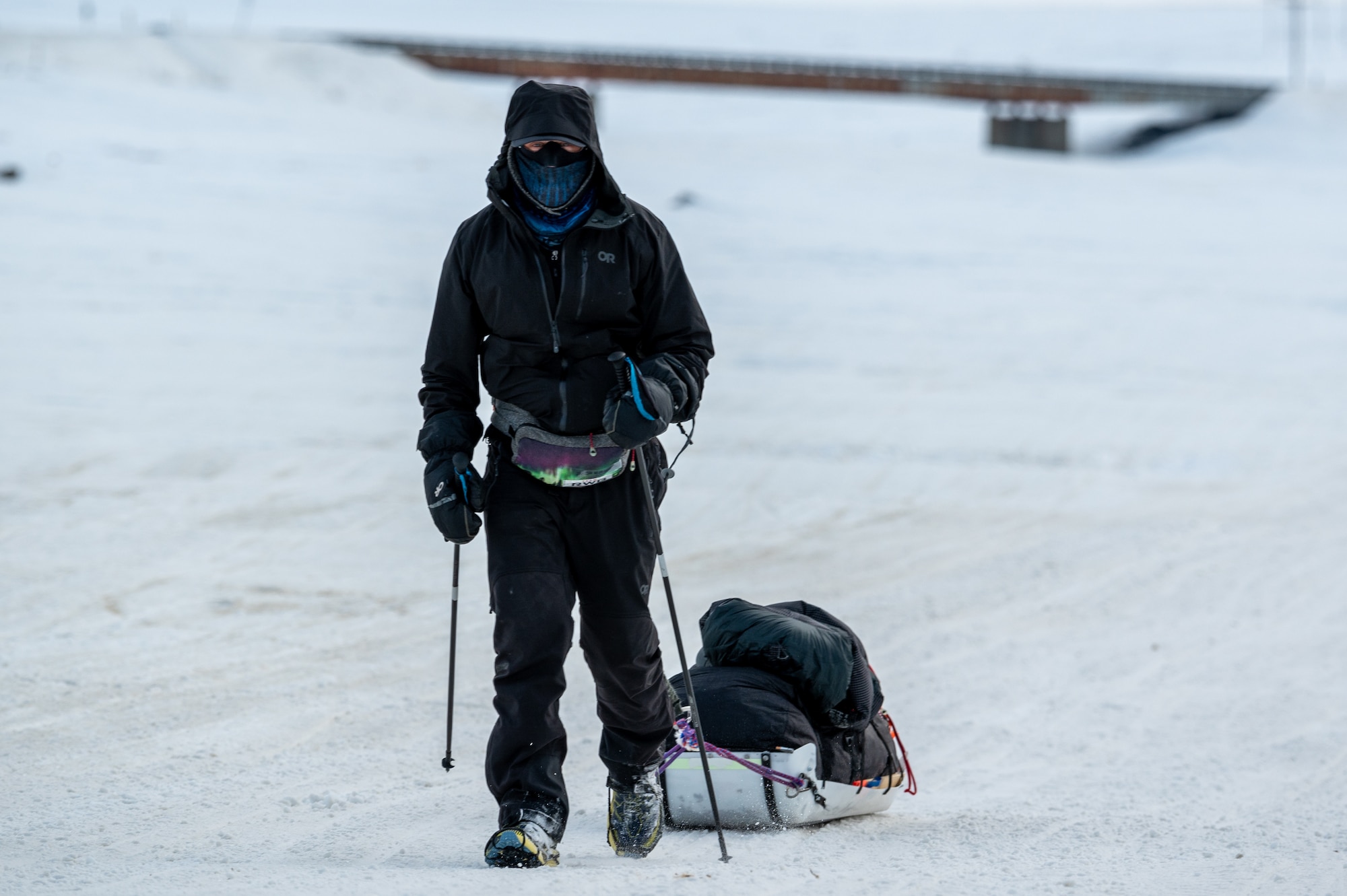 Maj. Joshua Brown hikes across icy terrain.