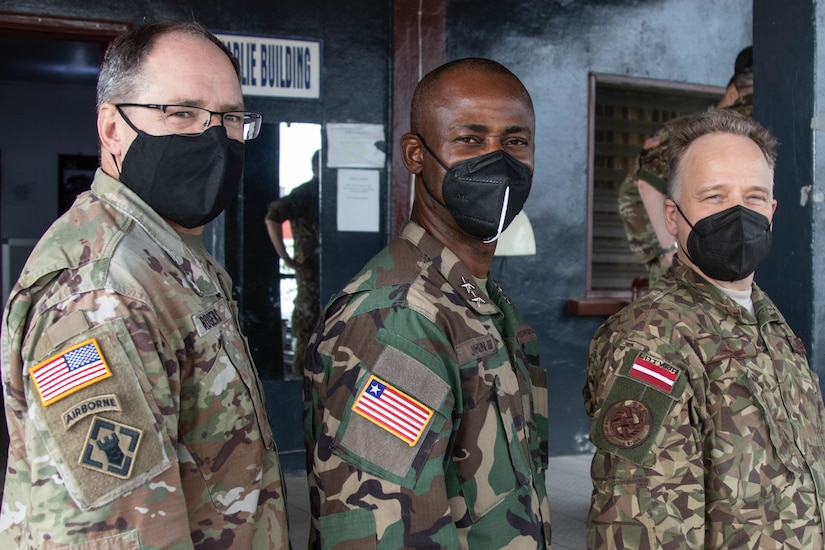 U.S. Army Maj. Gen. Paul Rogers, adjutant general, Michigan National Guard (MING), left, stands with Armed Forces of Liberia (AFL) Maj. Gen. Prince C. Johnson, III, AFL’s chief of staff, and Latvian National Armed Forces (LNAF) Brig. Gen. Imants Ziedins, LNAF’s deputy chief of defense, in Monrovia, Liberia Feb. 9, 2022. The event took place during a key leader engagement held Feb. 4-13, 2022, in Monrovia, involving delegations from MING, LNAF and the AFL. MING is further strengthening its State Partnership Program between the militaries from both countries. (U.S. Army National Guard photo by Capt. Joe Legros)