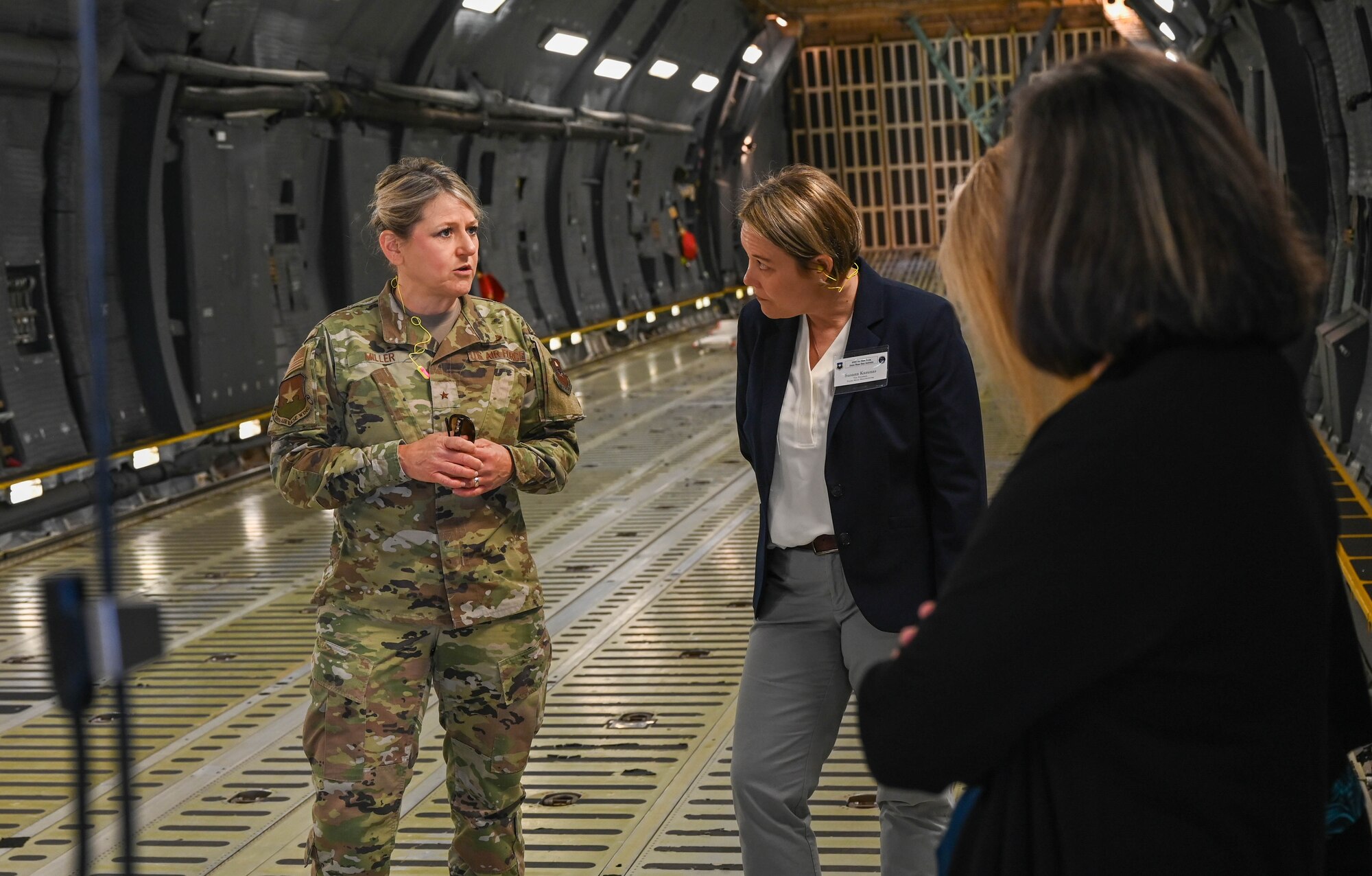 Brig. Gen. Caroline M. Miller, 502nd Air Base Wing commander, speaks to 502nd ABW honorary commanders during a tour of a 433rd Airlift Wing assigned C-5M Super Galaxy at Joint Base San Antonio-Lackland, Texas, March 25, 2022. The Honorary Commanders’ visit promoted and fostered relationships between the military service and local community leaders. (U.S. Air Force photo by Airman Mark Colmenares)