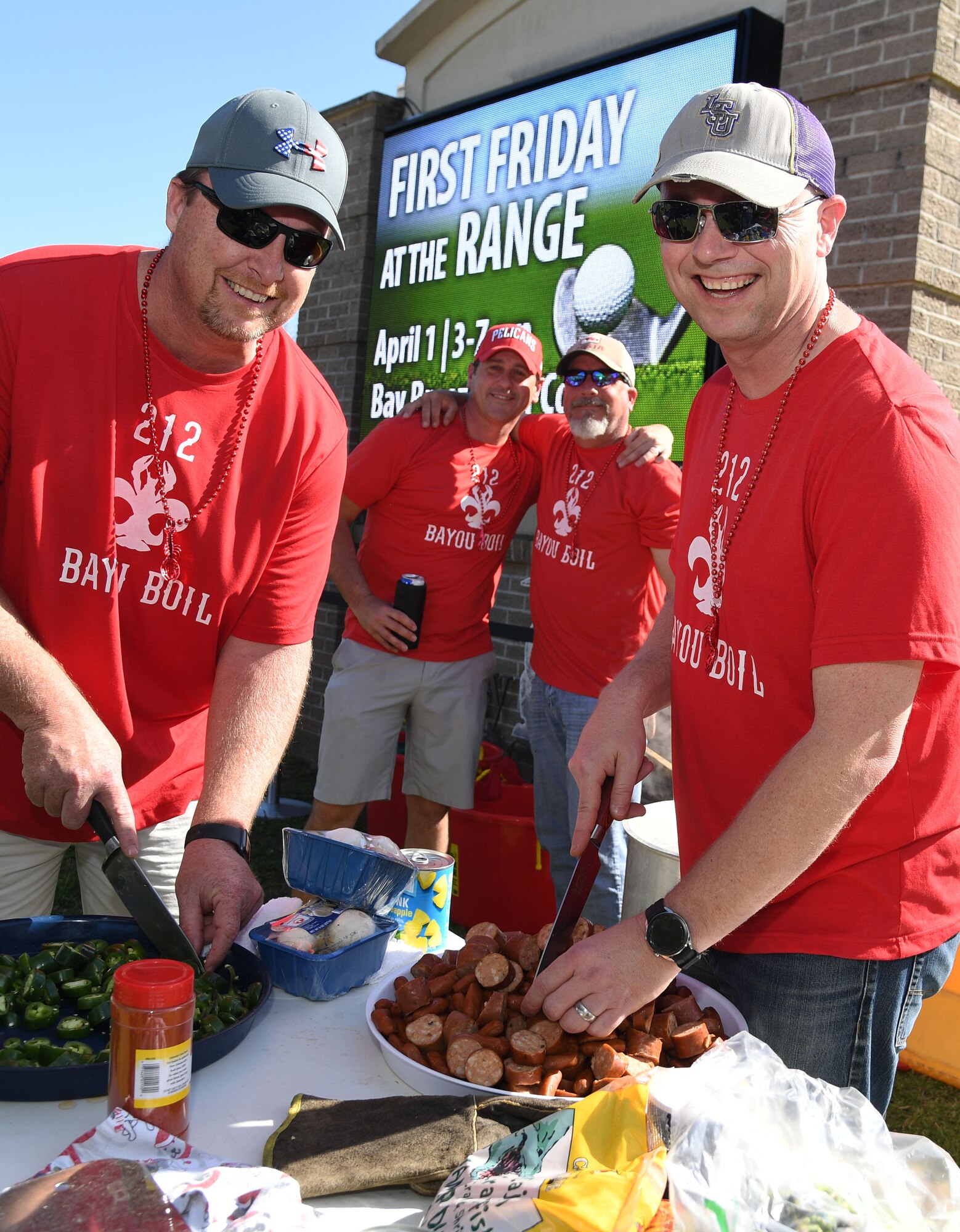 Members of team 212 Bayou Boil pose for a photo during the 10th Annual Crawfish Cook-Off at the Bay Breeze Event Center on Keesler Air Force Base, Mississippi, March 25, 2022. More than 20 teams competed in the event and more than 1,500 pounds of crawfish were distributed. (U.S. Air Force photo by Kemberly Groue)