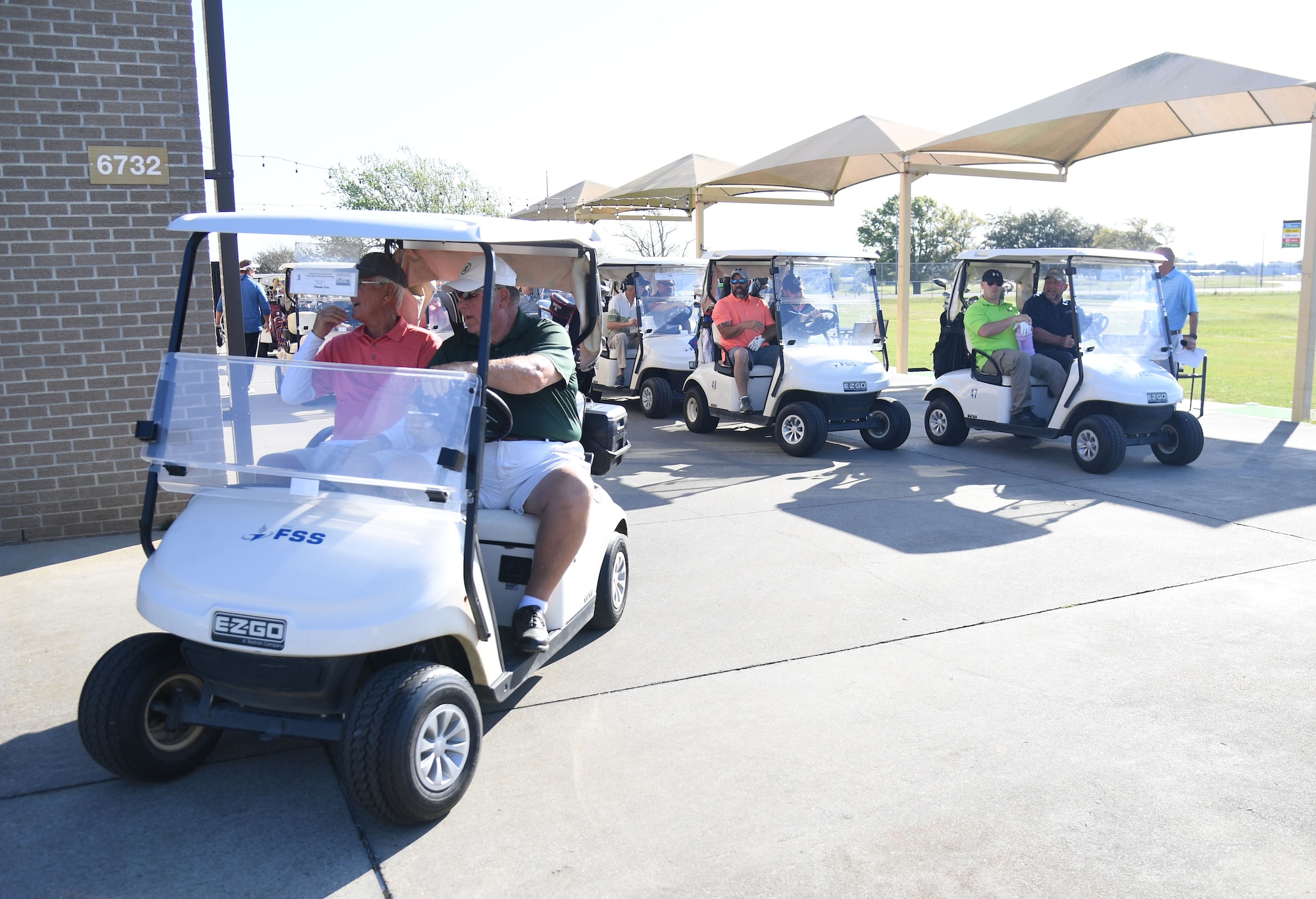 Participants cart to their respective holes during the Don Wylie Memorial Golf Tournament at the Bay Breeze Golf Course on Keesler Air Force Base, Mississippi, March 26, 2022. Keesler won the annual tournament against the Biloxi Bay Chamber of Commerce, which raised funds to help the Military & Veterans Affairs committee honor military members. (U.S. Air Force photo by Kemberly Groue)