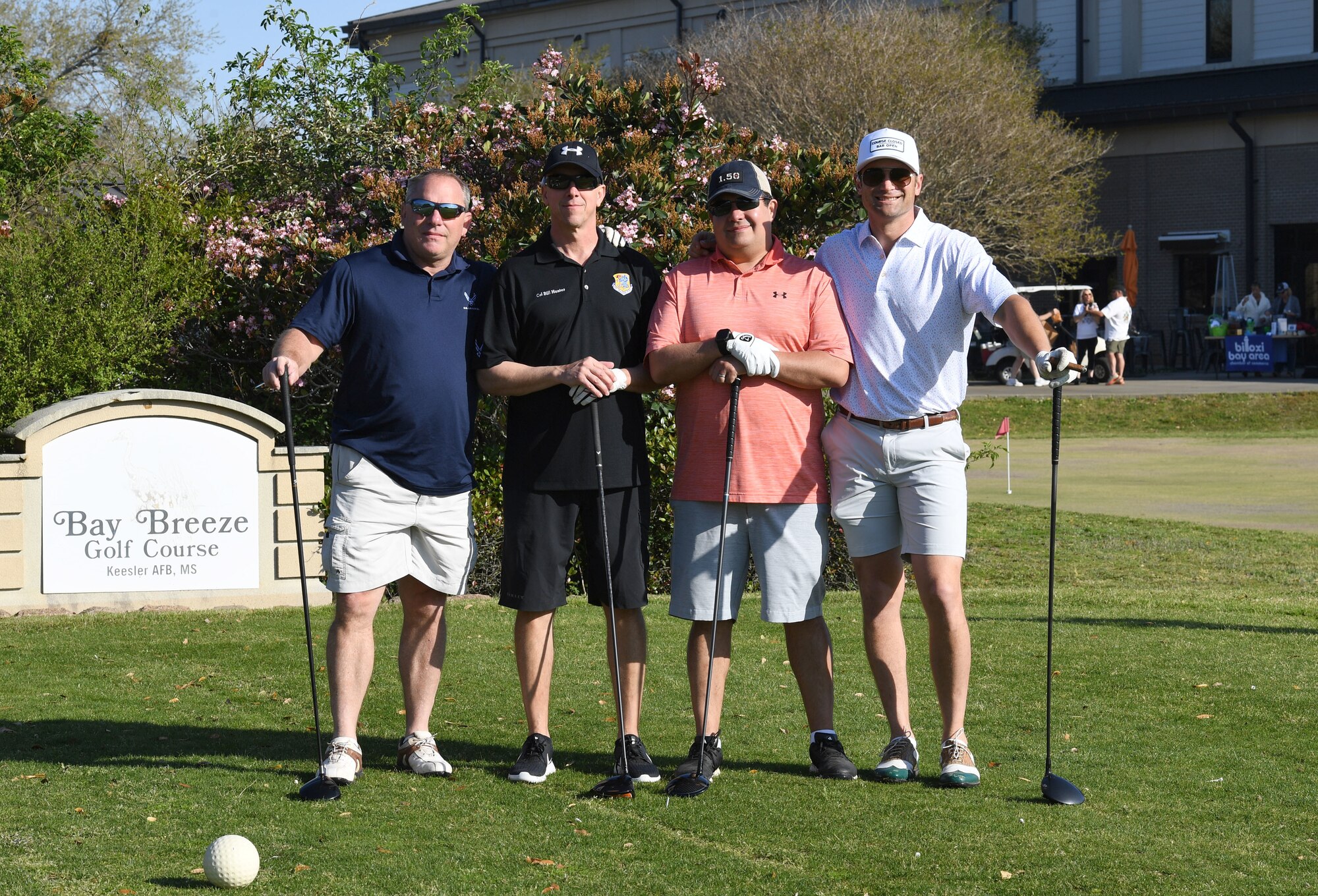 Tom Walker, Second Air Force financial management chief, U.S. Air Force Col. William Hunter, 81st Training Wing commander, Eric Sievers, Bancorp South first vice president, and Cree Cantrell, former president of the Biloxi Bay Chamber of Commerce, pose for a photo during the Don Wylie Memorial Golf Tournament at the Bay Breeze Golf Course on Keesler Air Force Base, Mississippi, March 26, 2022. Keesler won the annual tournament against the Biloxi Bay Chamber of Commerce, which raised funds to help the Military & Veterans Affairs committee honor military members. (U.S. Air Force photo by Kemberly Groue)