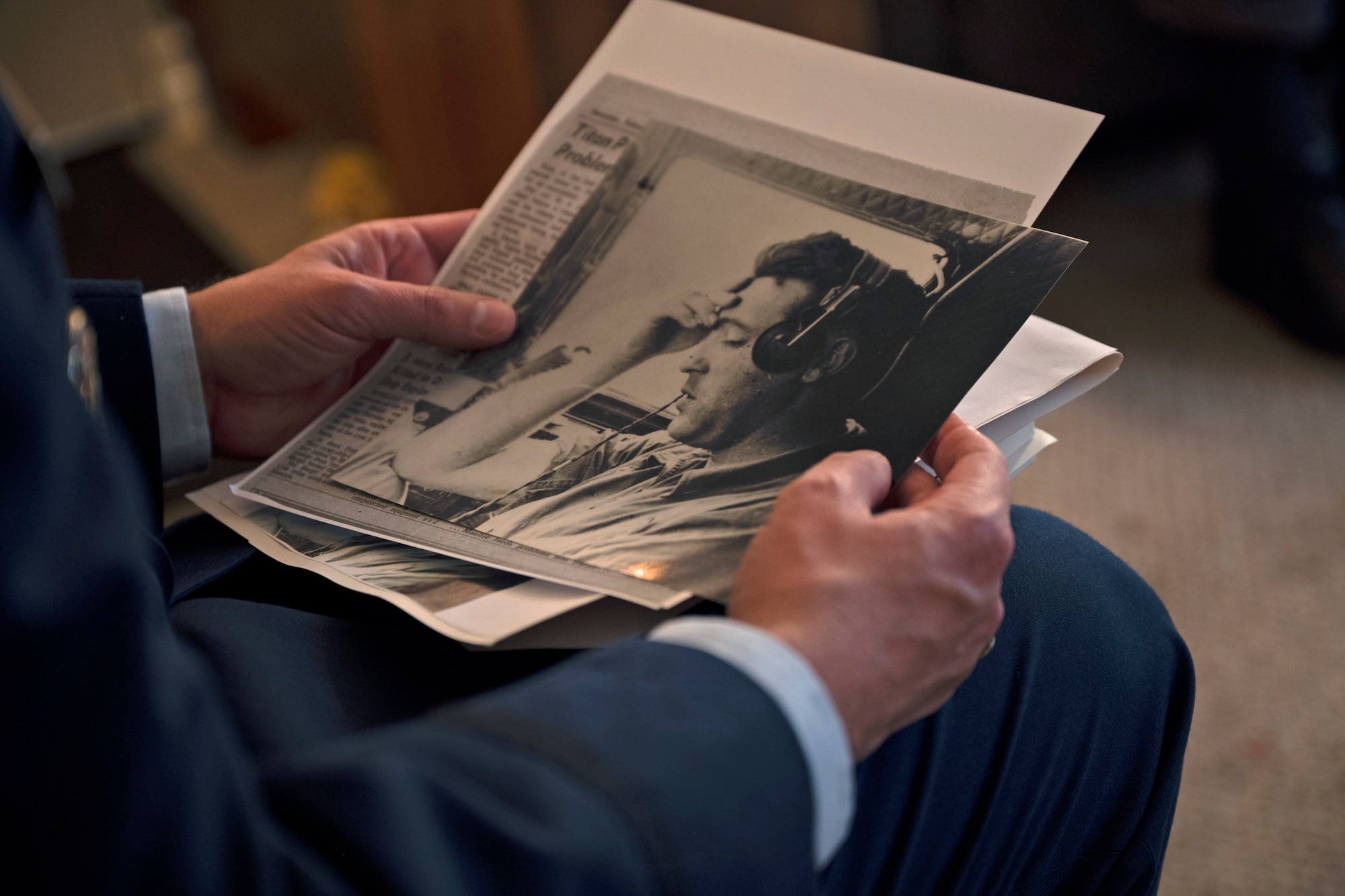 U.S. Air Force Col. Sergio Anaya, 62nd Operations Group commander, looks at photos and newspaper articles written about retired Maj. James Slaeker, a WWII pilot, during a visit to Shoreline, Washington, March 25, 2022, for Slaeker’s 100th birthday. Upon becoming a pilot, Slaeker would serve during three wars, including WWII and the Korean War. (U.S. Air Force photo/Senior Airman Zoe Thacker)