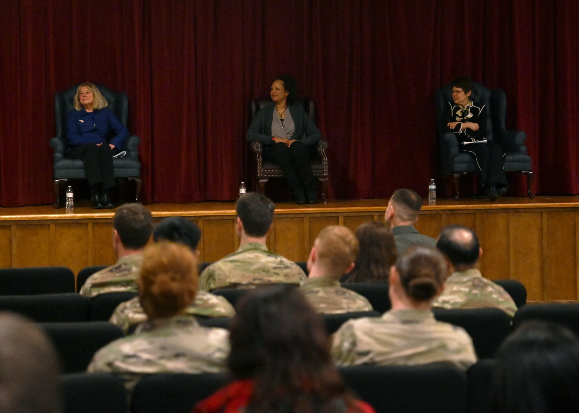 Retired U.S. Air Force Col. Peggy Phillips, left, Retired Lt. Col. Kimberly Ford, center, and Ms. Laina Reeves, sit on a Women in Aviation Panel at Joint Base Lewis-McChord, Washington, March 28, 2022. The panel shared their personal experiences as women in a male-dominated career field in celebration of Women’s History Month. (U.S. Air Force photo by Airman 1st Class Callie Norton)