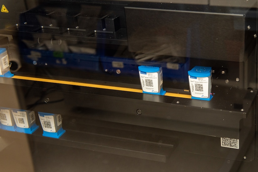 A photo of COVID-19 samples running through an analyzer.
