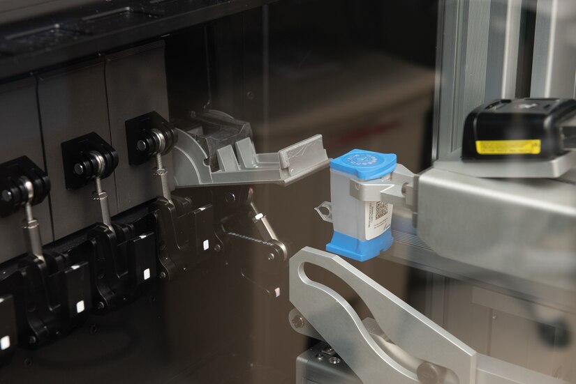 A photo of a COVID-19 sample running through an analyzer.