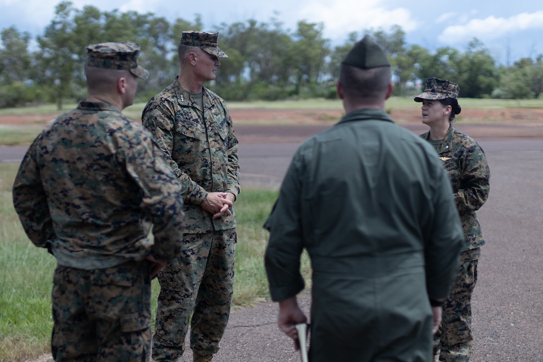 From left, U.S. Marine Corps  Col. Christopher Steele, Marine Rotational Force Darwin (MRF-D) 22 commanding officer, Lt. Gen. Steven Rudder, commander of Marine Forces Pacific, Maj. Nathan Frame, executive officer, Marine Medium Tiltrotor Squadron (VMM) 268 Reinforced, MRF-D 22, and Lt. Col. Vanessa Clark, commanding officer of VMM 268 Reinforced, MRF-D 22, talk about the implementation of the Air Combat Element (ACE) in MRF-D 22, at Royal Australian Air Force (RAAF) Base, Darwin, NT, Australia, March 25, 2022. The ACE will utilize RAAF Base Darwin’s facilities as the main staging area and launch point for air operations during the rotation, in order to maintain credible crisis and contingency-ready forces alongside the Australian Defence Force. (U.S. Marine Corps Photo by Cpl. Cedar Barnes)