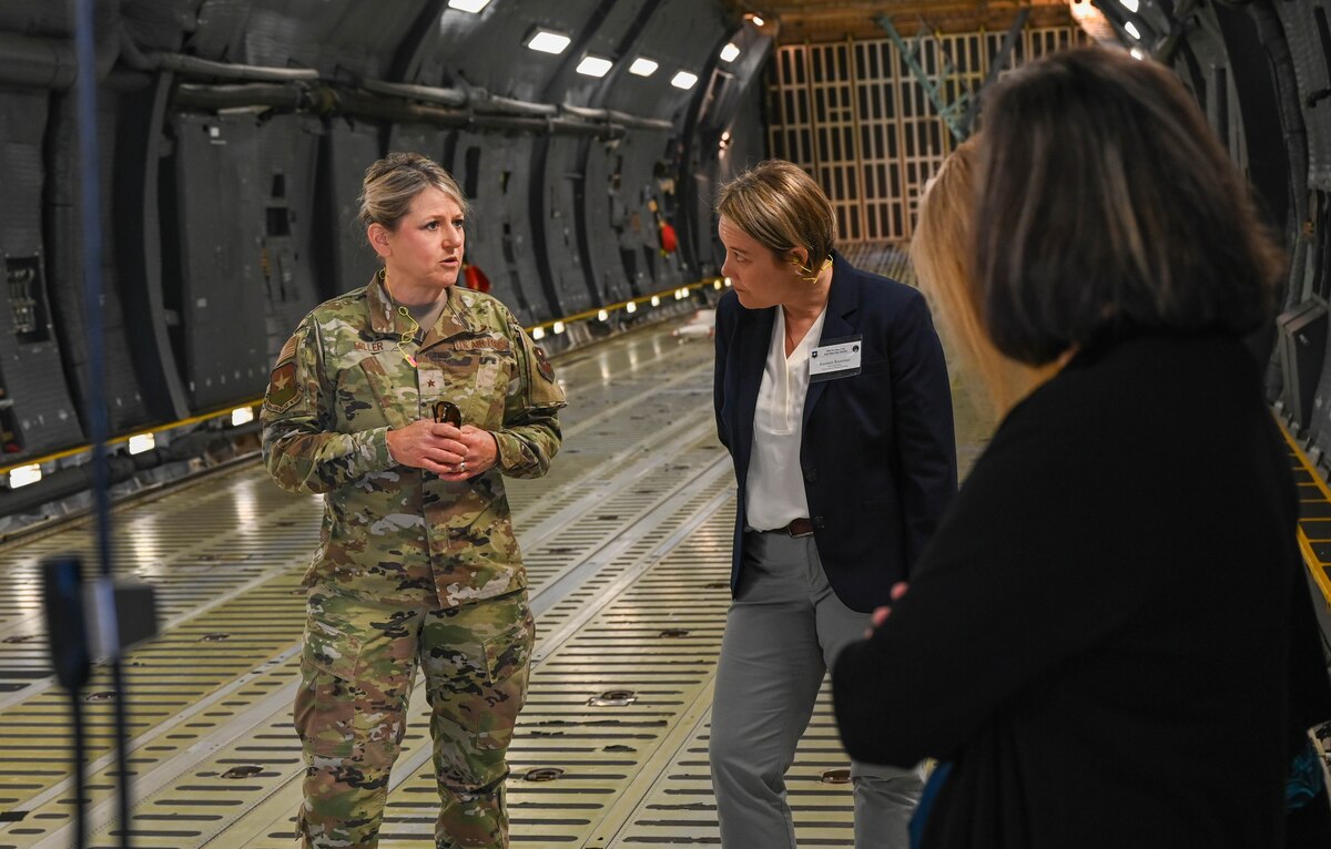 Brig. Gen. Caroline M. Miller, 502nd Air Base Wing commander, speaks to 502nd ABW honorary commanders during a tour of a 433rd Airlift Wing assigned C-5M Super Galaxy at Joint Base San Antonio-Lackland, Texas, March 25, 2022. The Honorary Commanders’ visit promoted and fostered relationships between the military service and local community leaders. (U.S. Air Force photo by Airman Mark Colmenares)