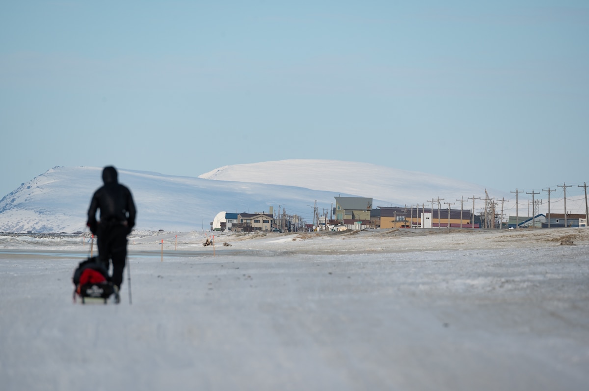 Maj. Joshua Brown hikes into Nome, Alaska.