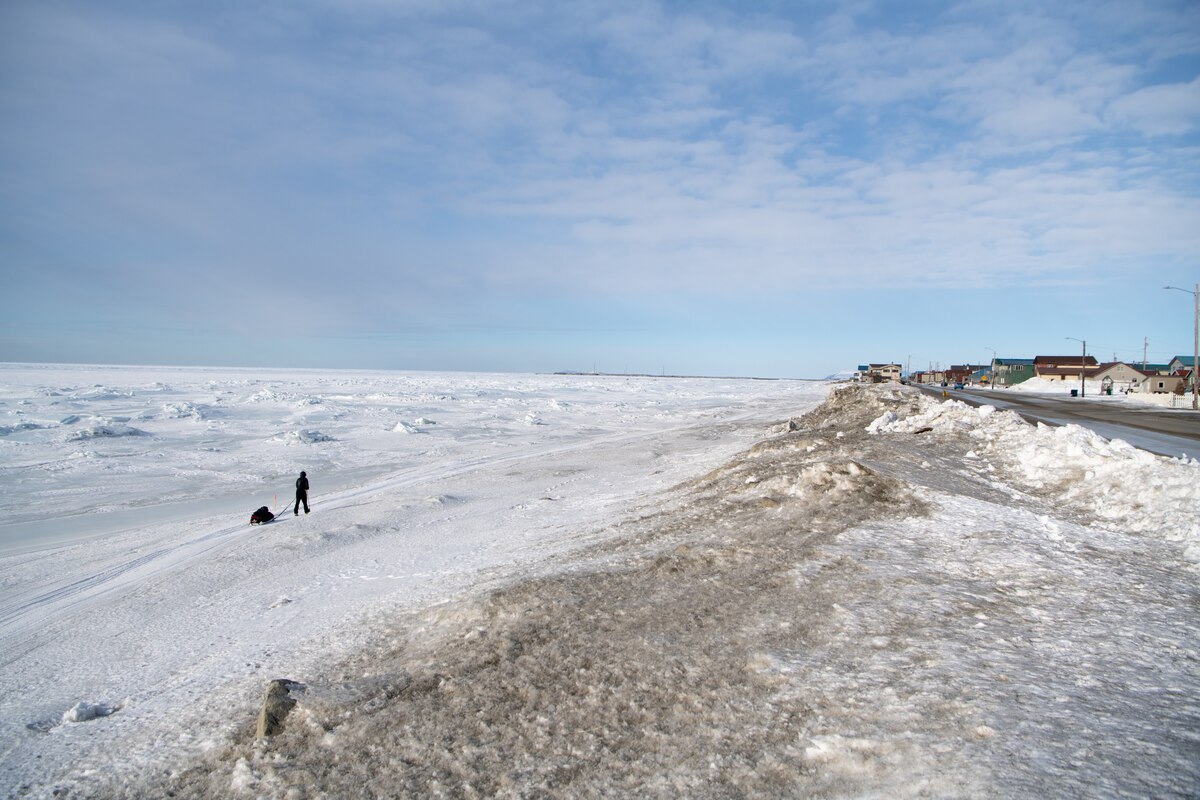 Maj. Joshua Brown hikes into Nome, Alaska.