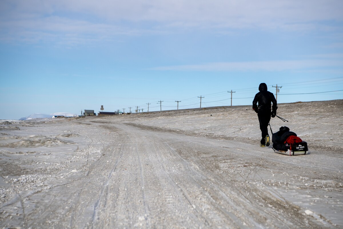 Maj. Joshua Brown hikes into Nome, Alaska.