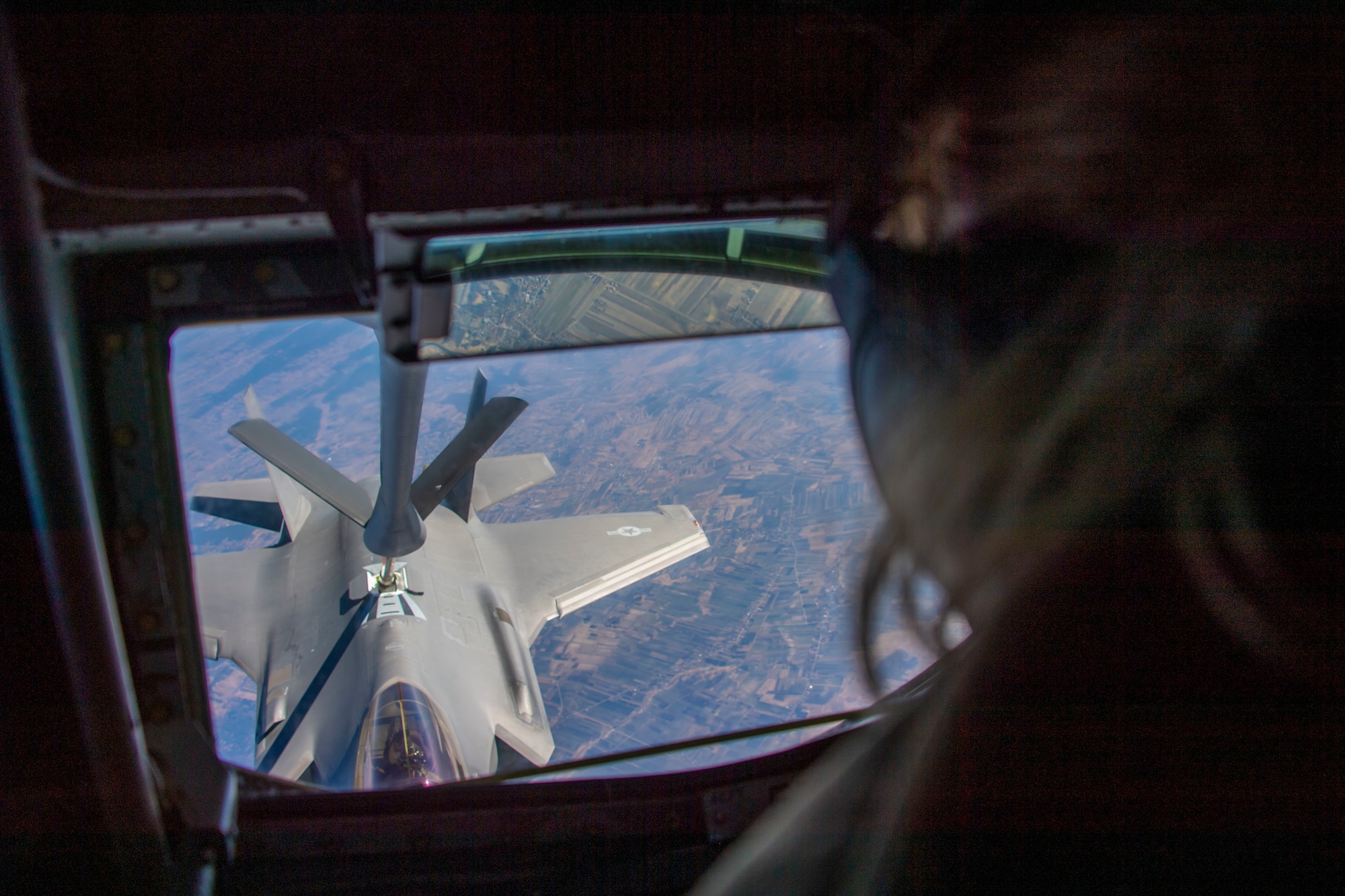 U.S. Air Force Senior Airman Constance Cassens, 92nd Air Refueling Squadron KC-135 boom operator assigned to Fairchild Air Force Base, Washington, refuels an F-35A Lighting II assigned to Hill Air Force Base, Utah, March 22, 2022. Airmen assigned to Fairchild AFB were deployed to bolster air refueling operations in support of NATO’s collective defense. (U.S. Air Force photo by Airman 1st Class Jessica Sanchez-Chen)