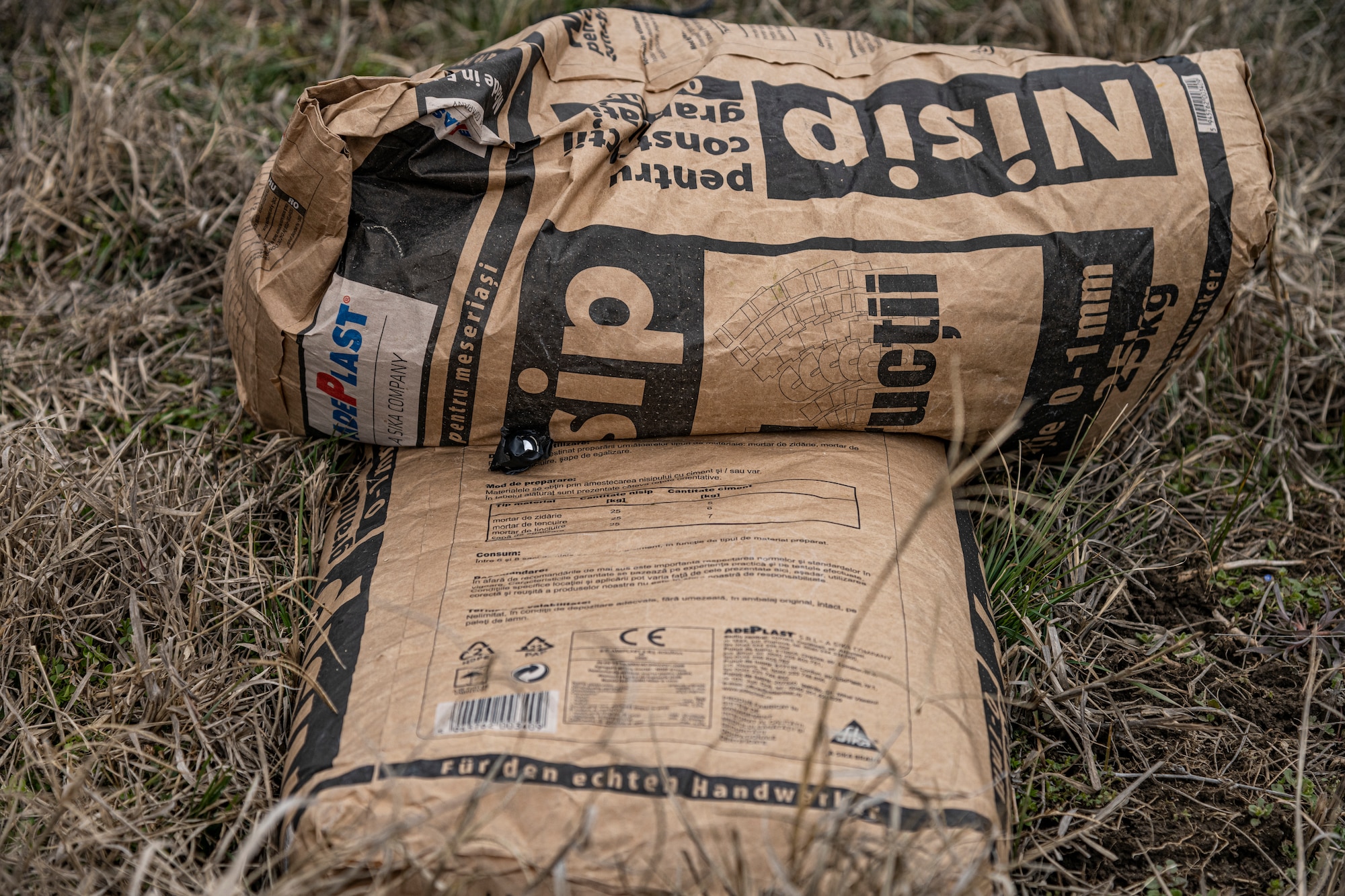 A device used on F-16 Fighting Falcons responsible for triggering flares sits on a sandbag Prior to detonation at the 86th Air Base, Romania, March 16, 2022. This device was found to have a small amount of corrosion and therefore had to be safely disposed of. (U.S. Air Force photo by Senior Airman Ali Stewart)