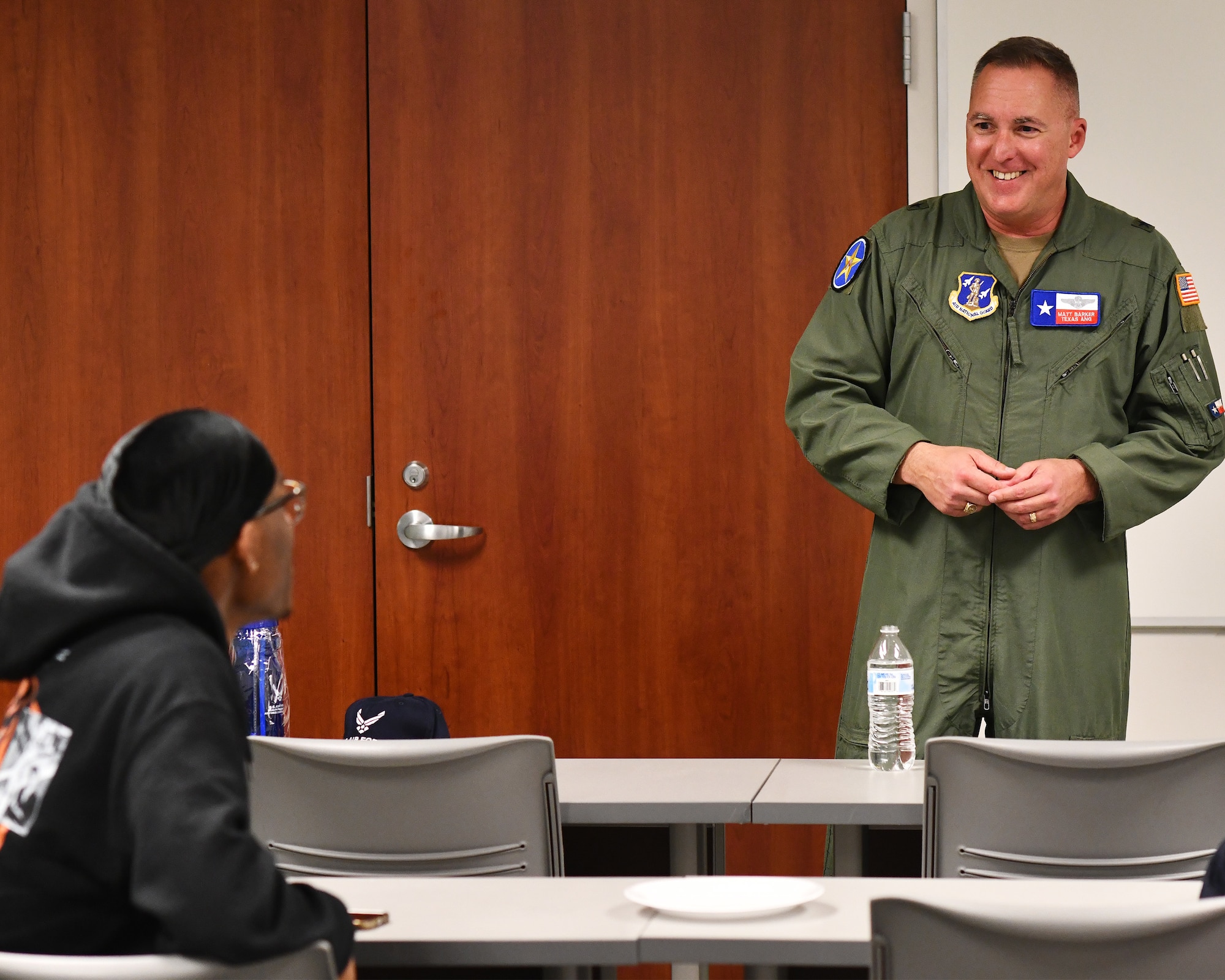 Brig. Gen. Matthew Barker (right), Texas Air National Guard chief of staff, speaks with students at the University of Houston about opportunities within the Air Force, Air Force Reserve and Air National Guard, Feb. 23, 2022, in Houston.